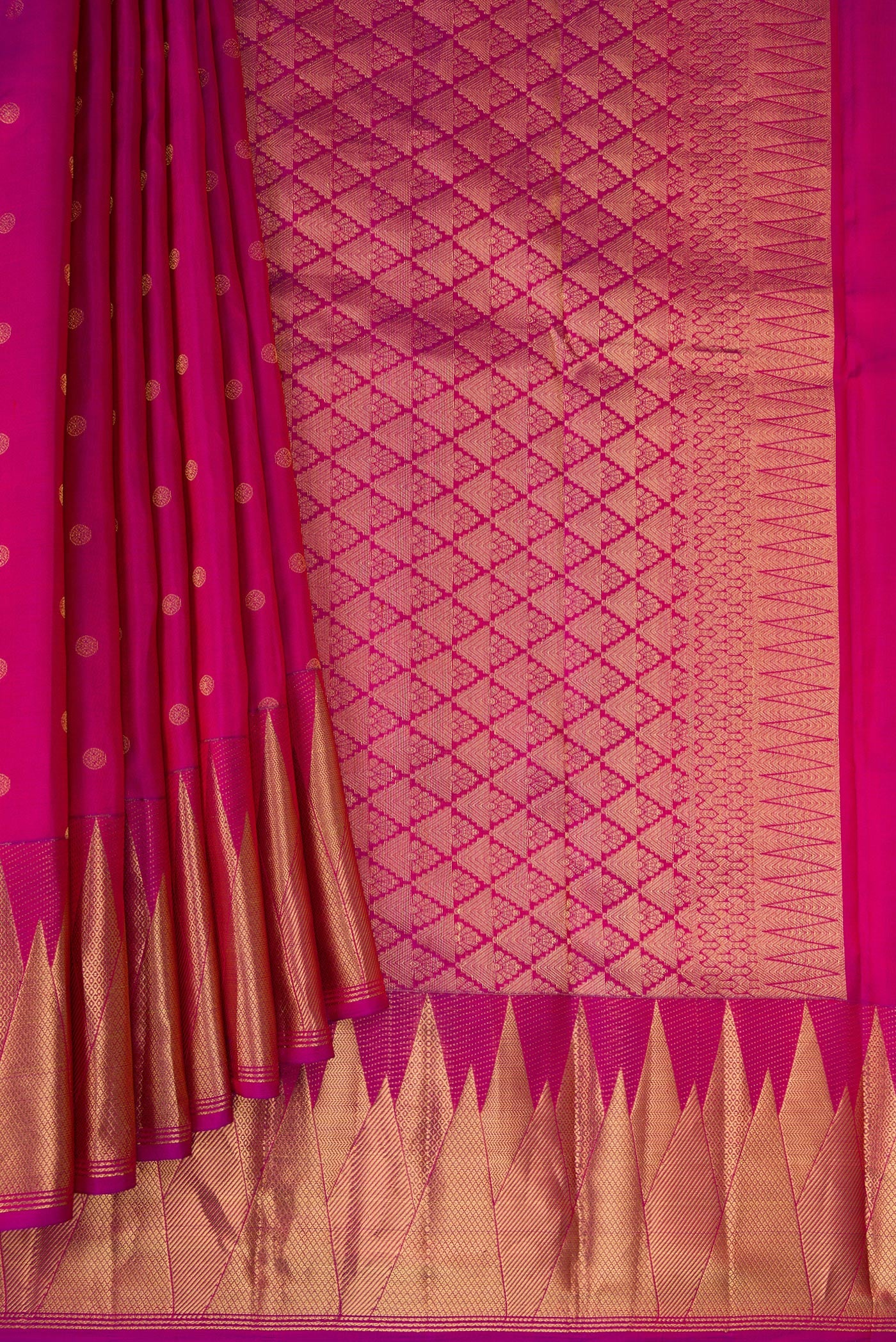 Pleats and pallu of Magenta Kanchipuram Silk Saree with Zari Butta on the body and Temple Border. 