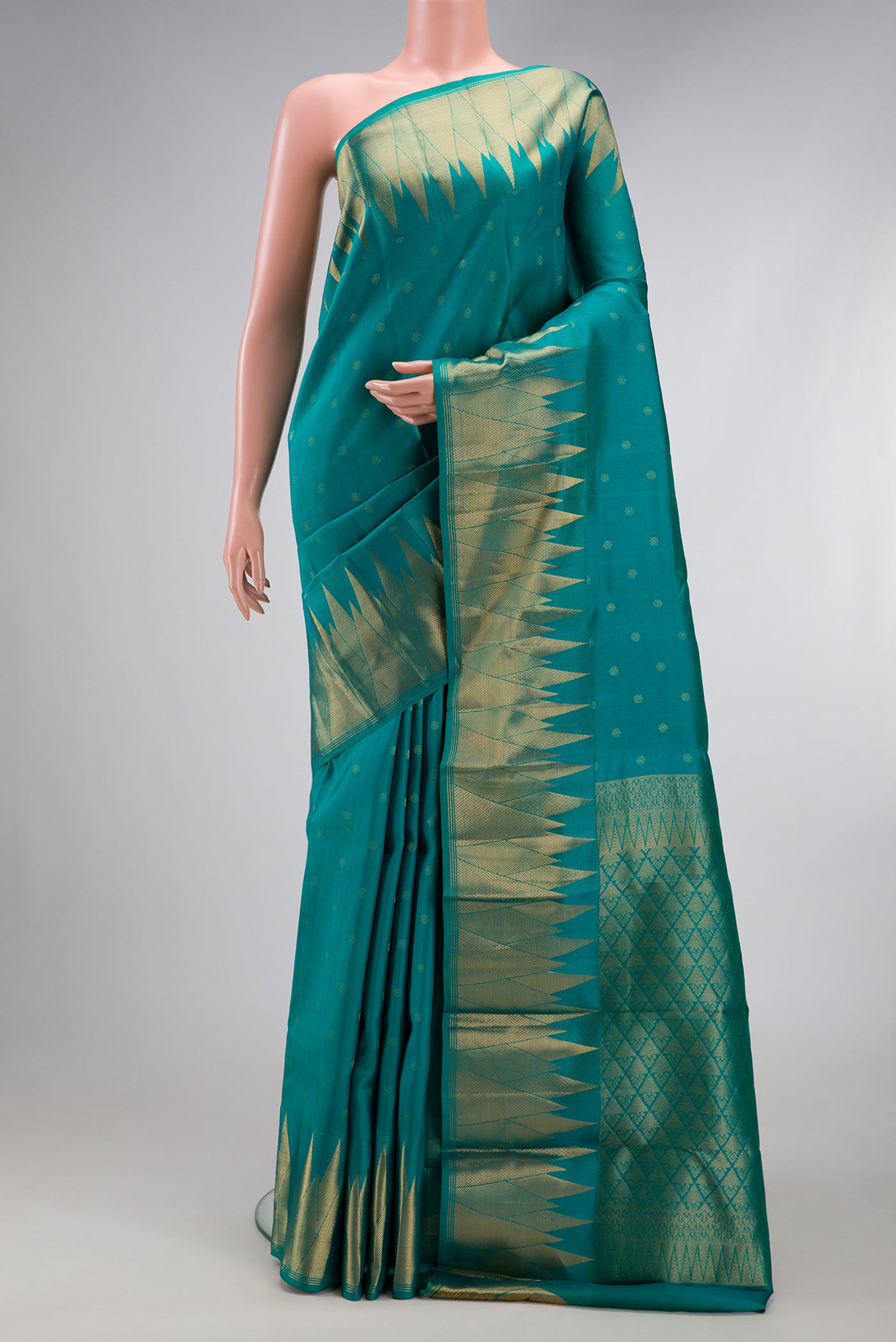 Sea Green Kanchipuram Silk Saree with Zari Butta on the body and Fancy Border.  displayed on a mannequin