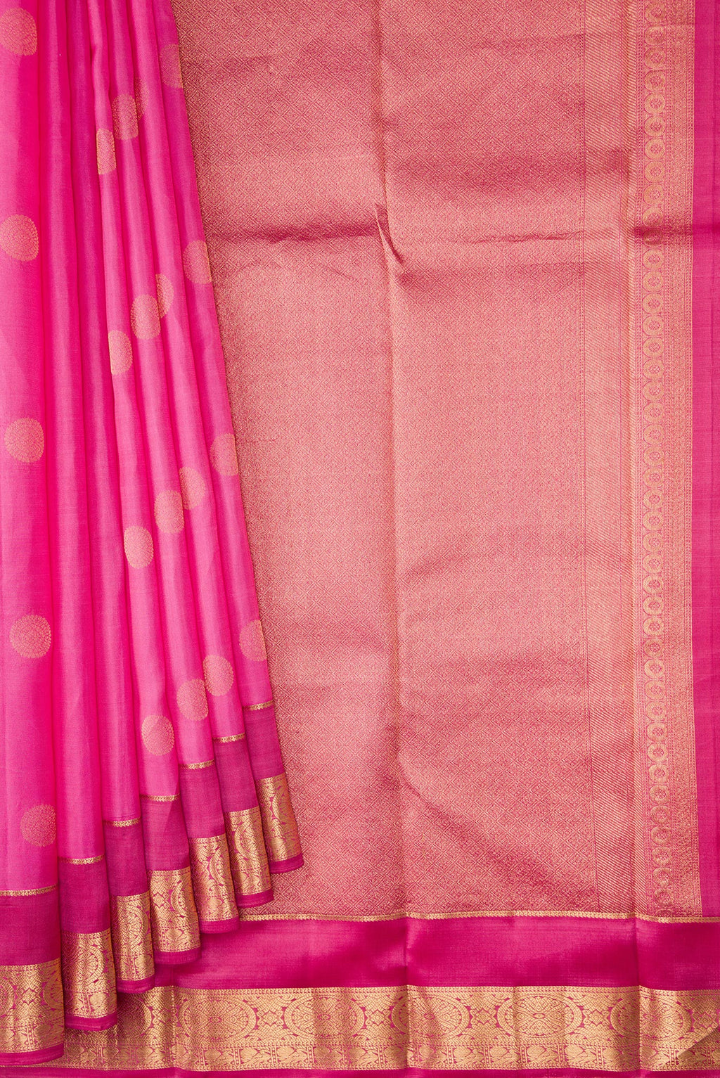 Pleats and pallu of Rose Gold Kanchipuram Silk Saree with Zari Butta on the body and Zari Border. 