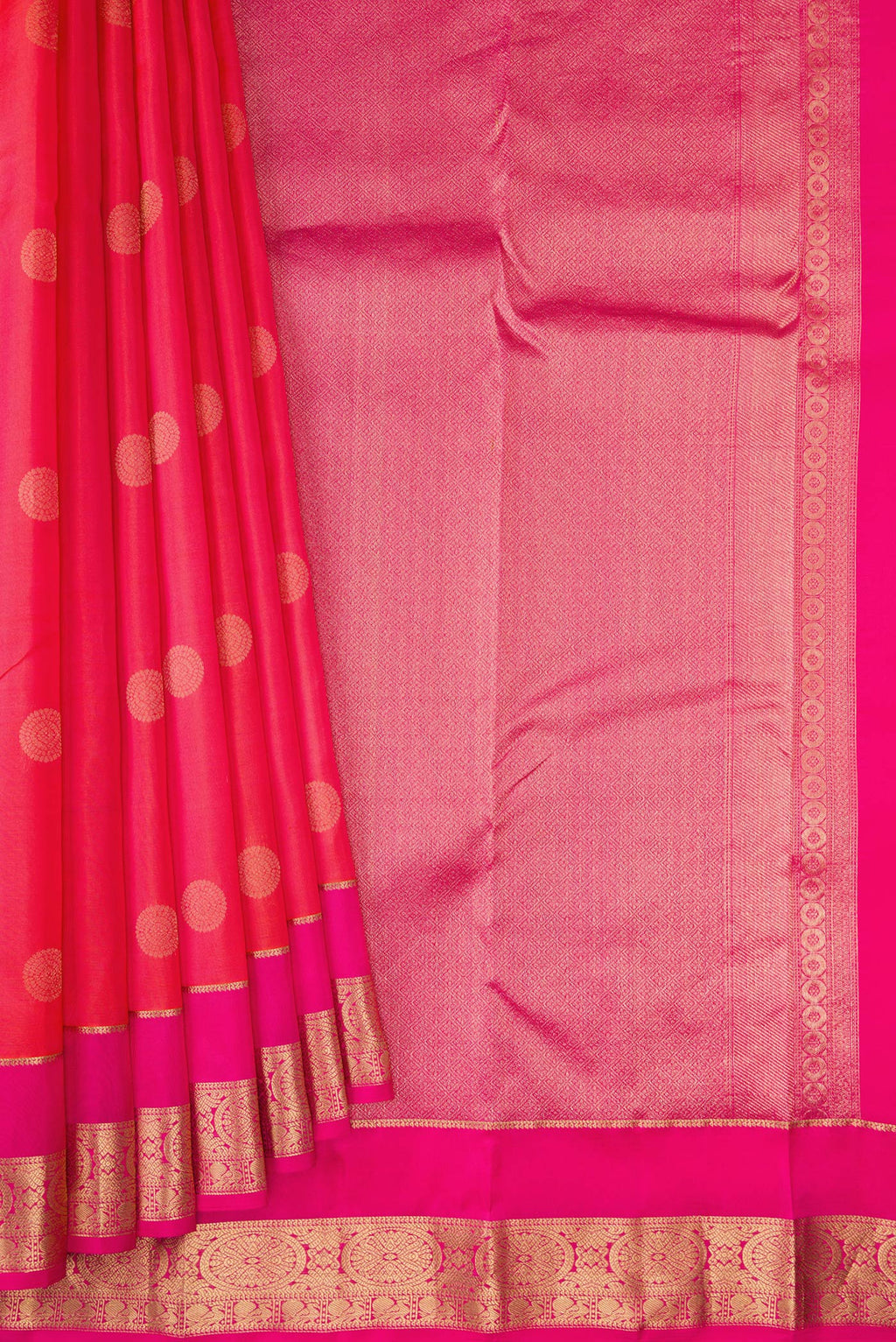 Pleats and pallu of Coral Dual Tone Kanchipuram Silk Saree with Zari Butta on the body and Zari Border. 
