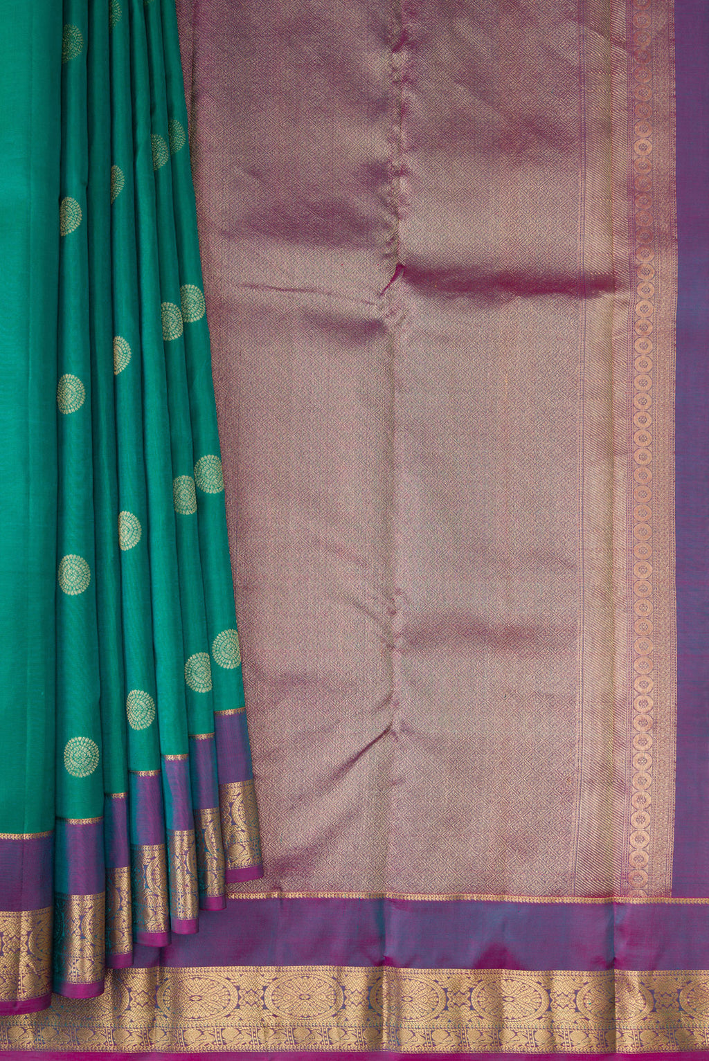 Pleats and pallu of Green Kanchipuram Silk Saree with Zari Butta on the body and Zari Border. 