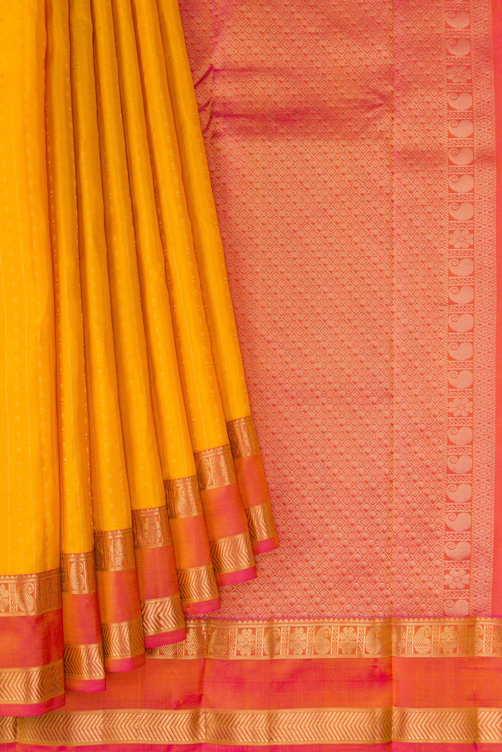 Pleats and pallu of Yellow Dual Tone Kanchipuram Silk Saree with Zari Butta on the body and Zari Border. 