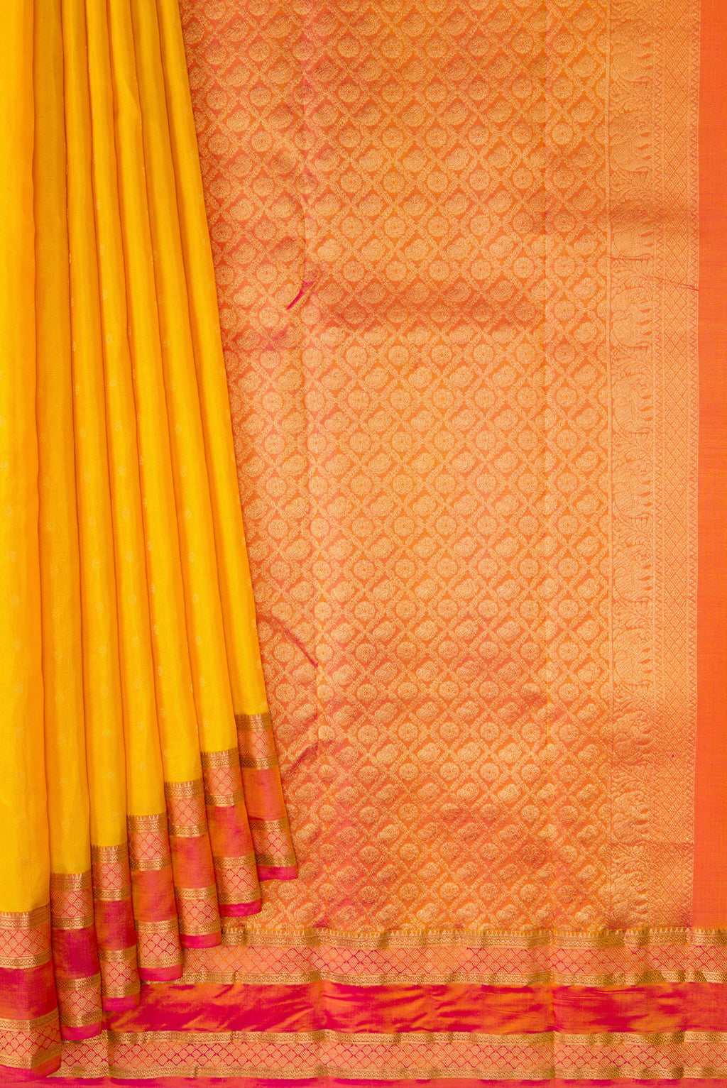 Pleats and pallu of Yellow Kanchipuram Silk Saree with Zari Butta on the body and Zari Border. 