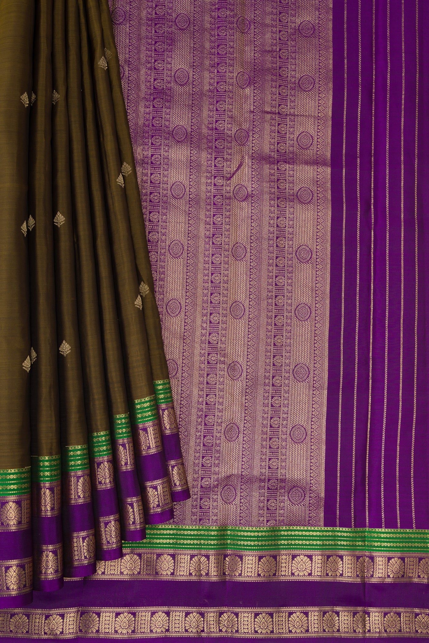 Pleats and pallu of Mehandi Green Kanchipuram Silk Saree with Zari Butta on the body and Zari Border. 