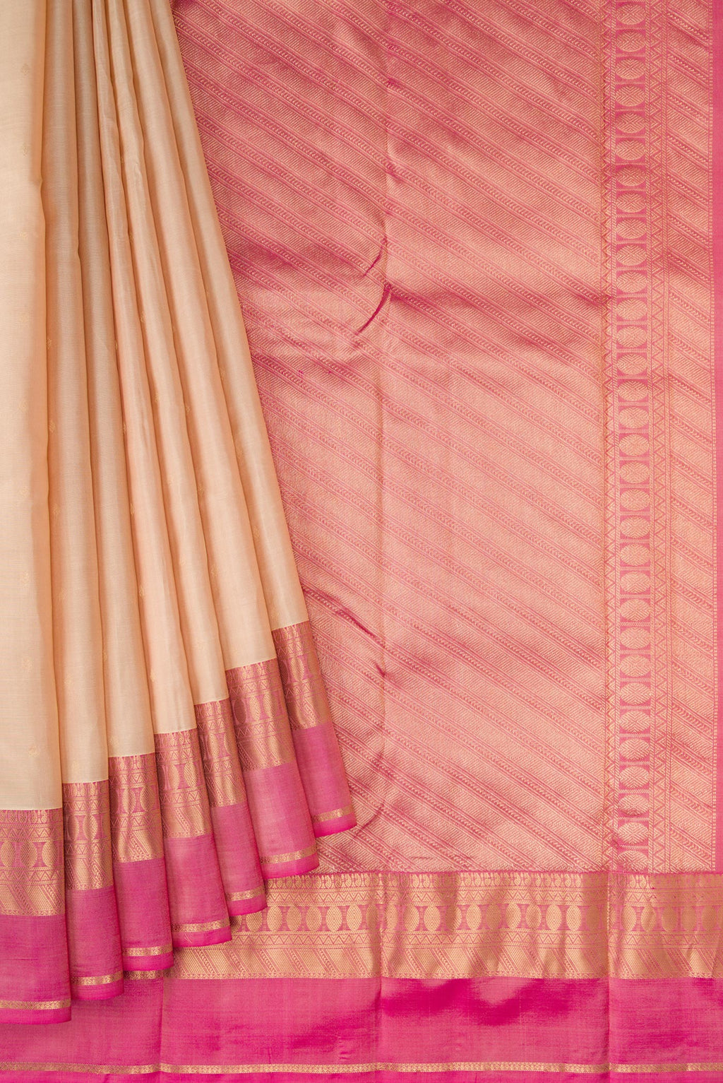 Pleats and pallu of Beige Kanchipuram Silk Saree with Zari Butta on the body and Zari Border. 