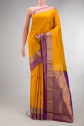 Pure Silk Yellow Kanchipuram Saree with Zari Butta on the body and Zari Border.  displayed on a mannequin