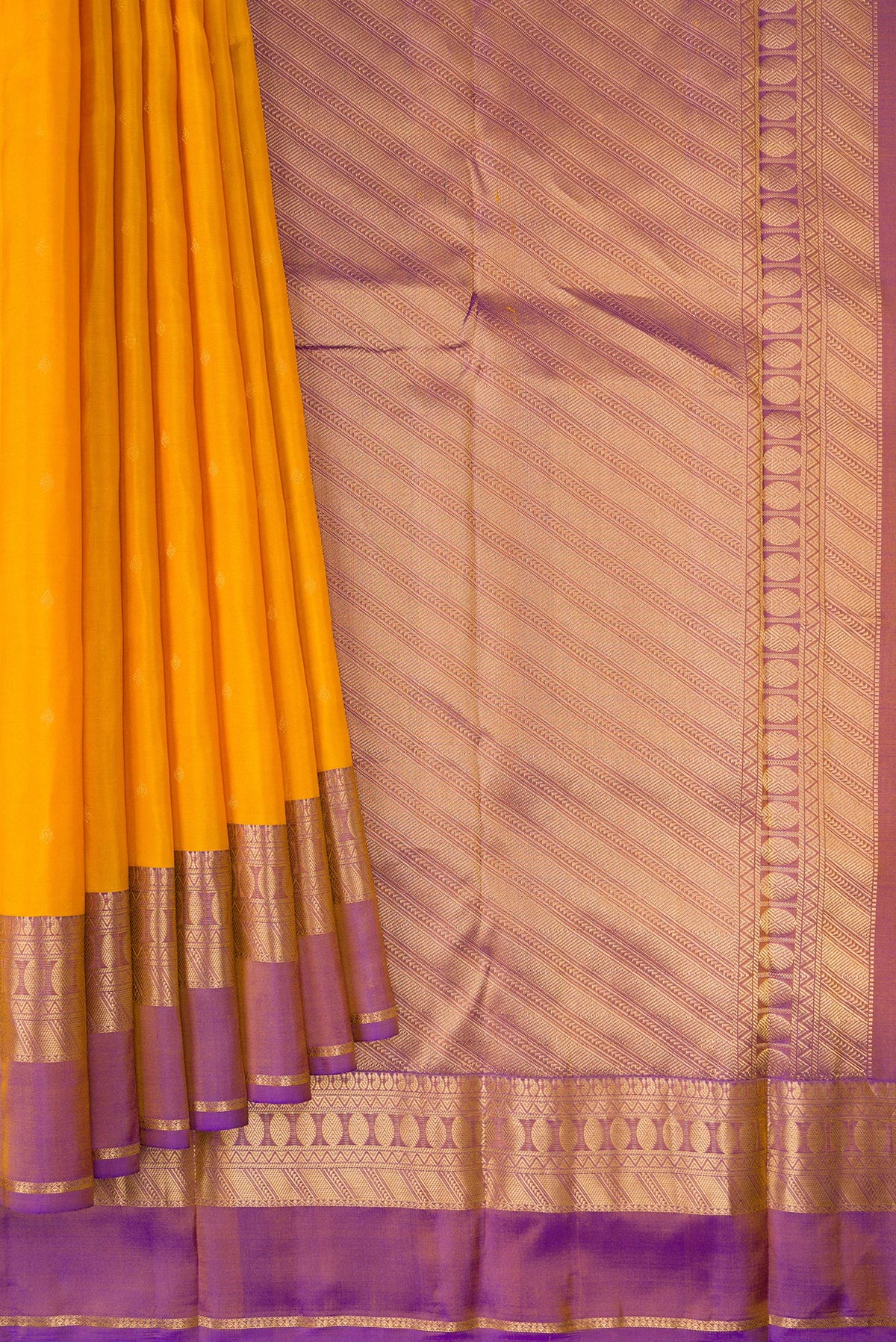 Pleats and pallu of Pure Silk Yellow Kanchipuram Saree with Zari Butta on the body and Zari Border. 