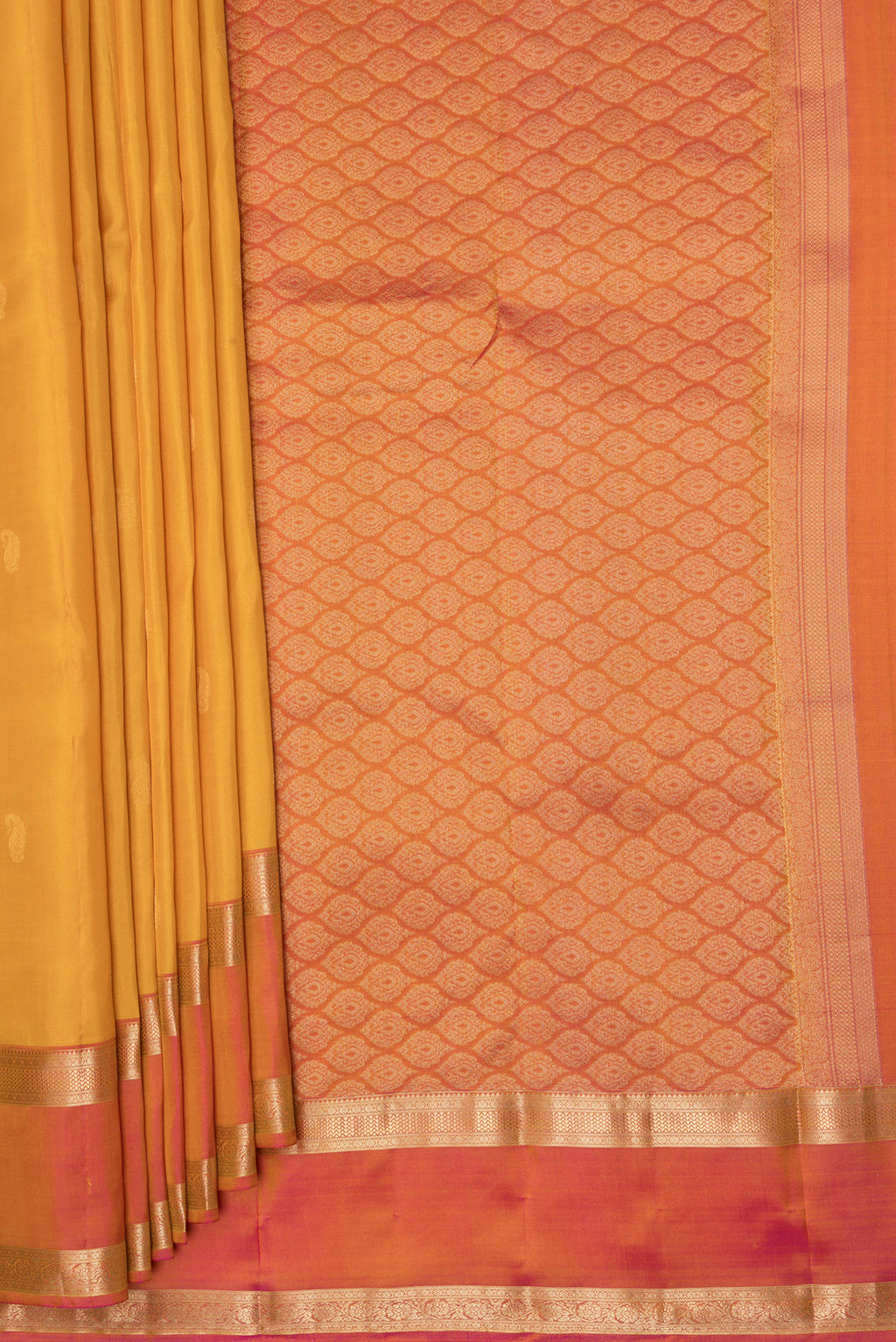 Pleats and pallu of Yellow Kanchipuram Silk Saree with Zari Butta on the body and Zari Border. 