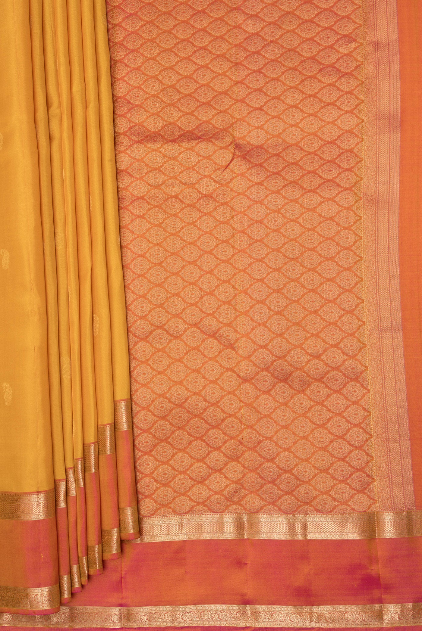 Pleats and pallu of Yellow Kanchipuram Silk Saree with Zari Butta on the body and Zari Border. 