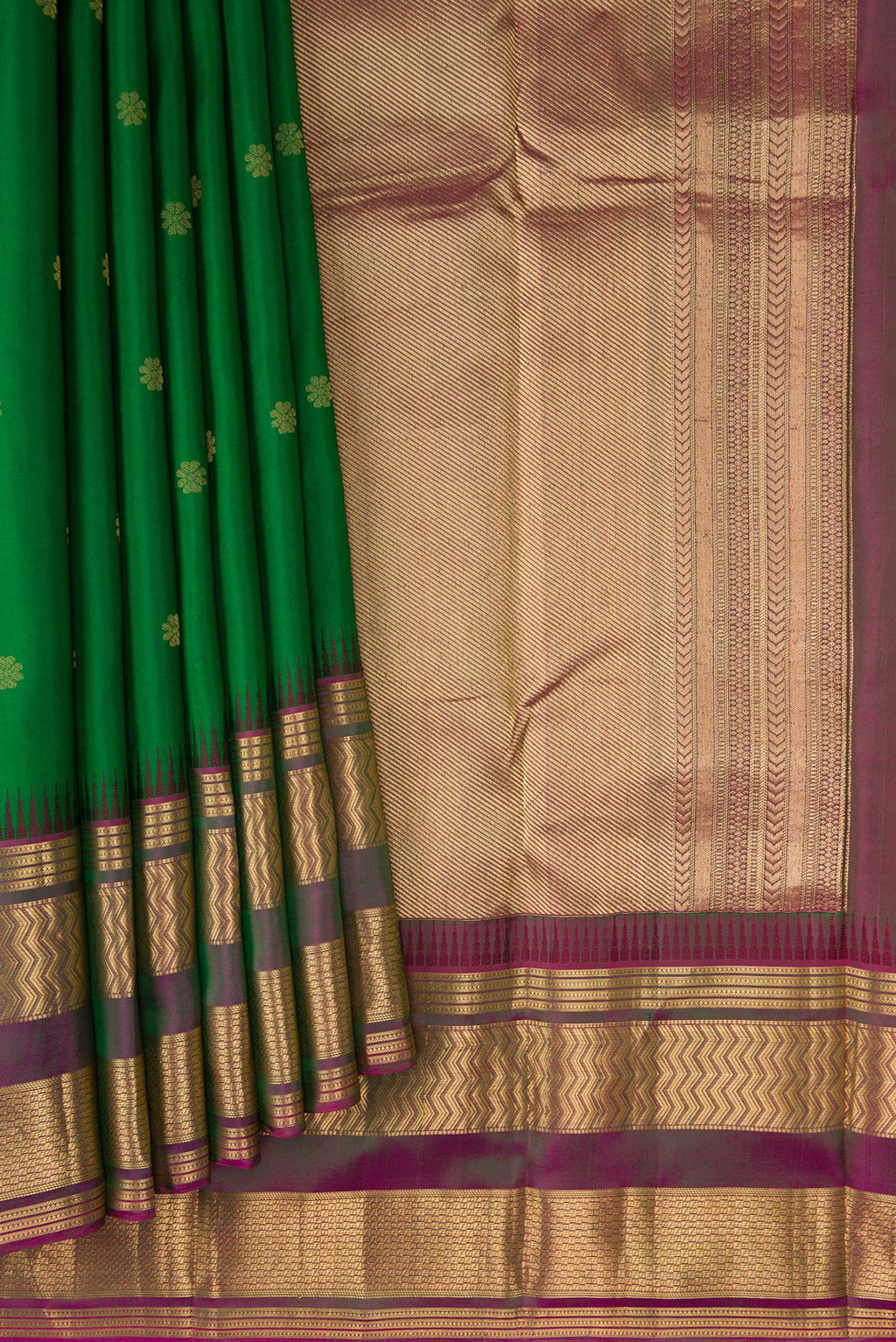 Pleats and pallu of Green Kanjivaram Silk Saree with Zari Butta on the body and Zari Border. 