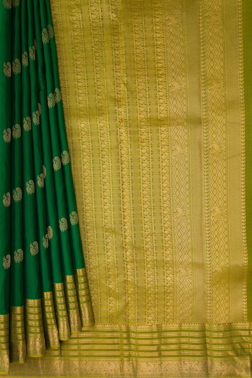 Pleats and pallu of Green Kanchipuram Silk Saree with Zari Butta on the body and Zari Border. 