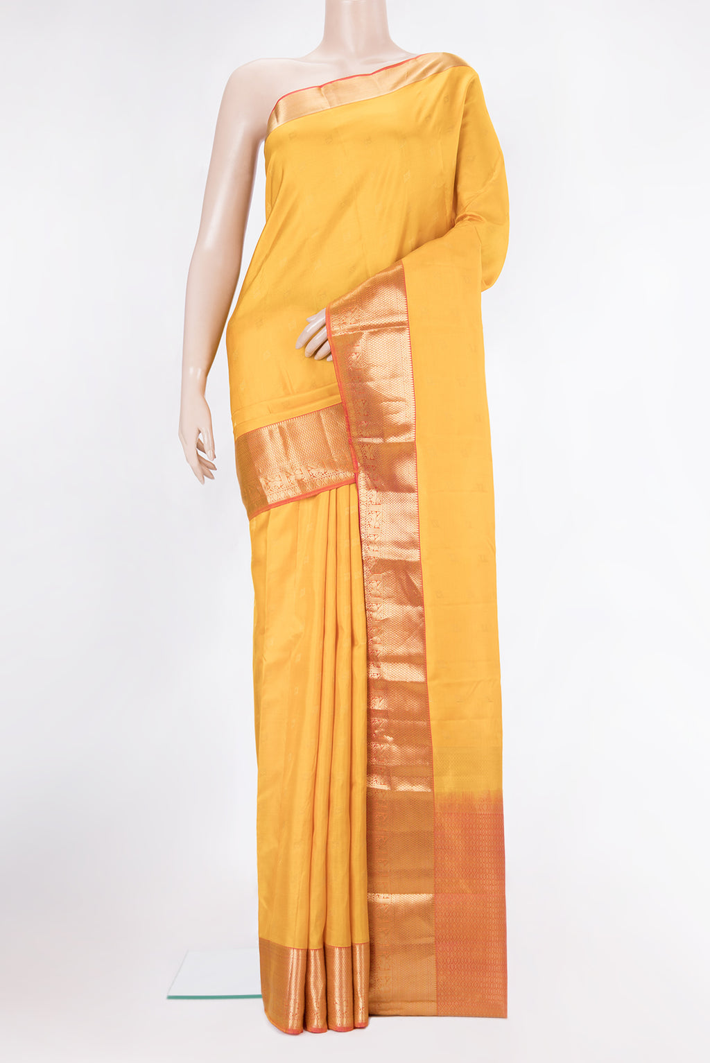 Pure Silk Yellow Kanchipuram Saree with Zari Butta on the body and Zari Border.  displayed on a mannequin