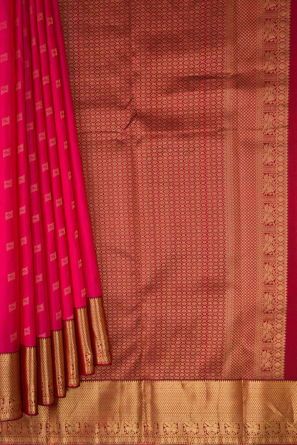 Pleats and pallu of Dark Pink Kanchipuram Silk Saree with Zari Butta on the body and Zari Border. 