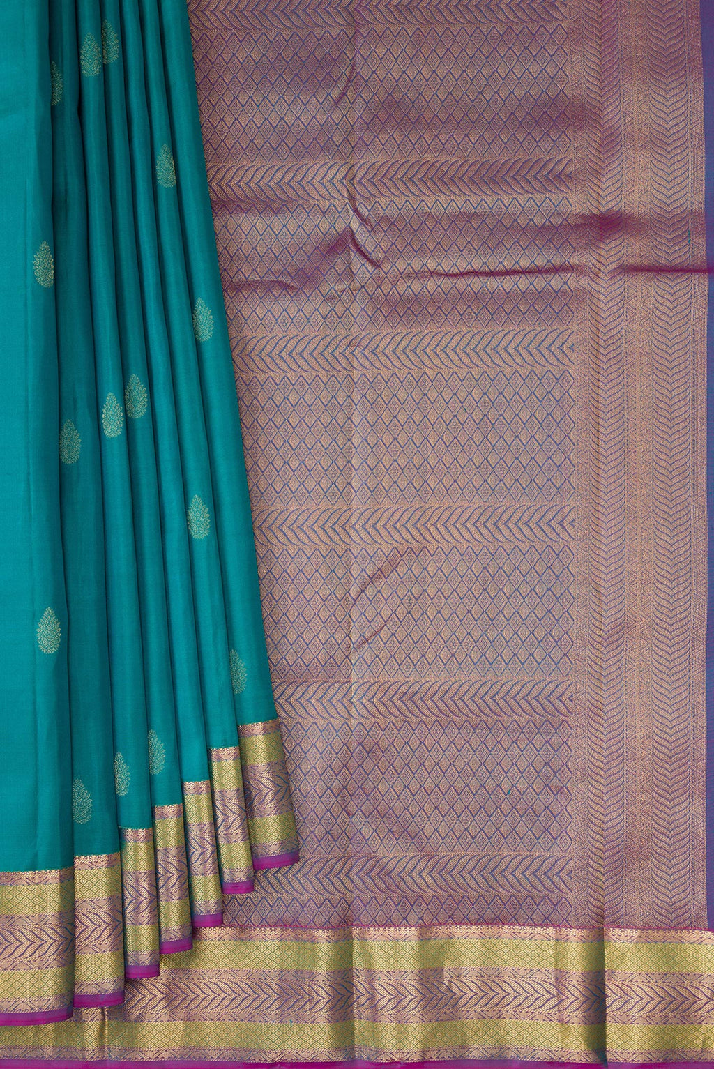 Pleats and pallu of Teal Kanchipuram Silk Saree with Zari Butta on the body and Zari Border. 