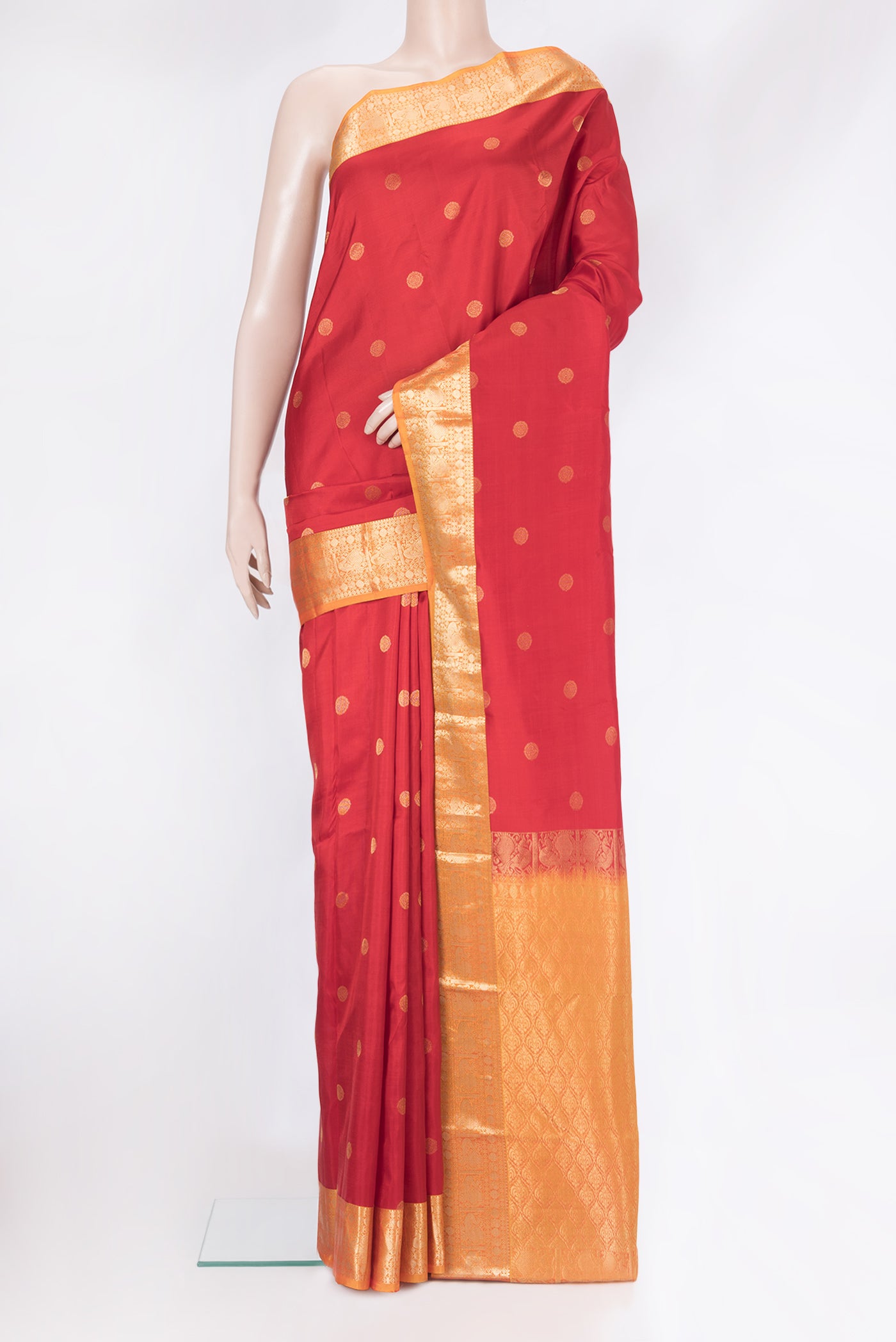 Red Kanchipuram Silk Saree with Zari Butta on the body and Zari Border.  displayed on a mannequin