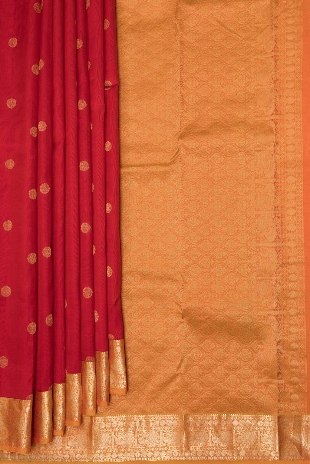 Pleats and pallu of Red Kanchipuram Silk Saree with Zari Butta on the body and Zari Border. 