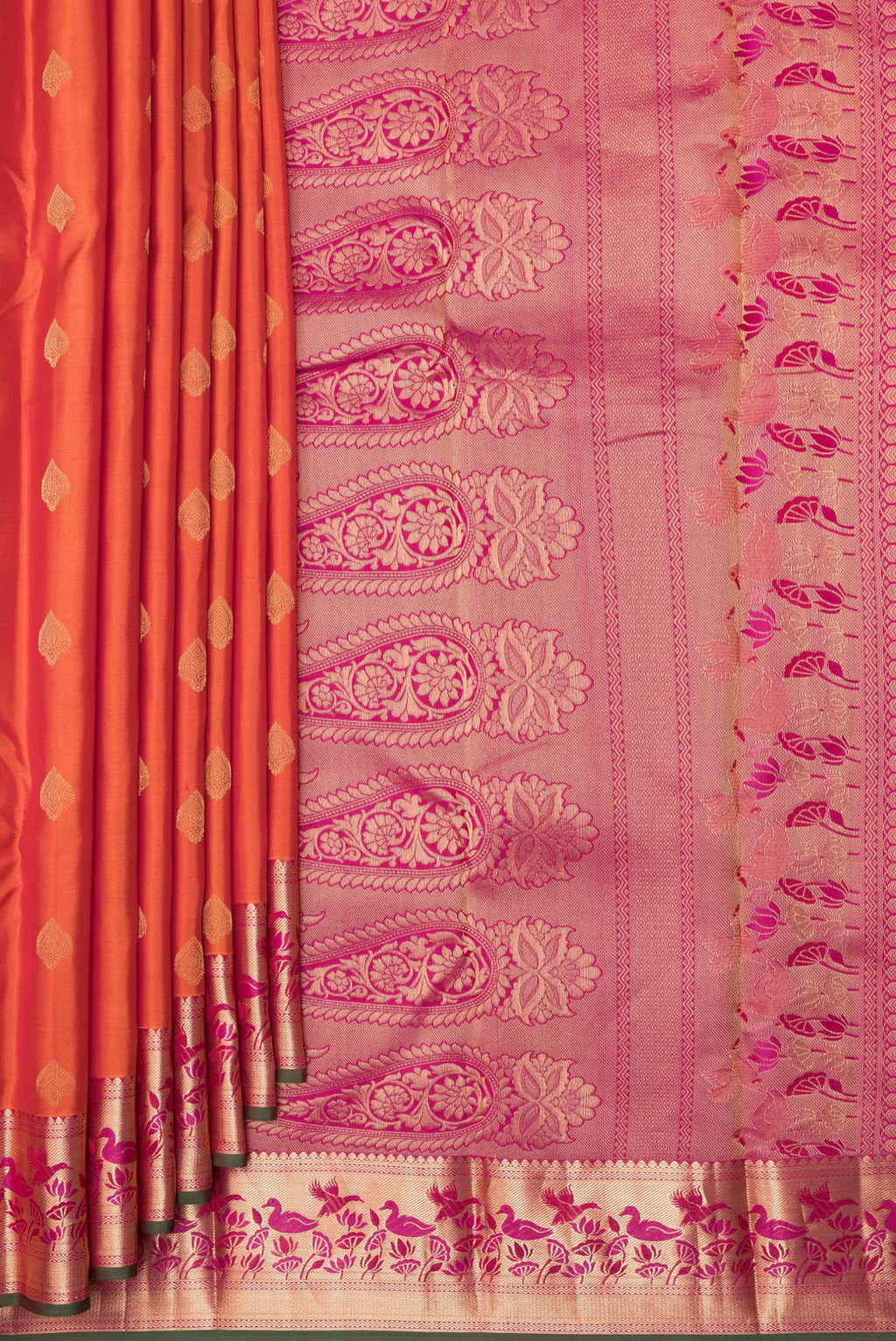 Pleats and pallu of Pure Silk Orange Kanjivaram Saree with Zari Butta on the body and Zari Border. 