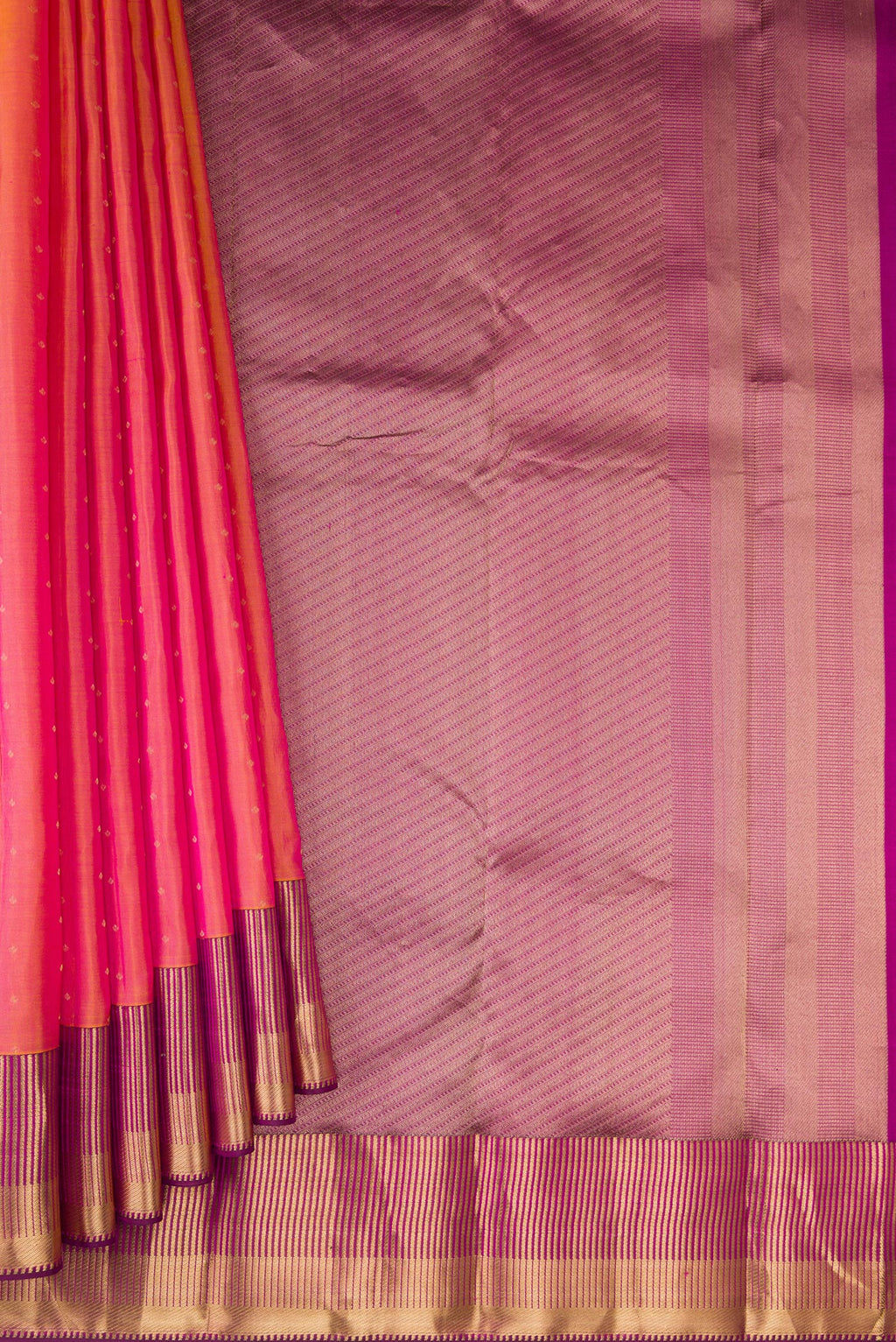 Pleats and pallu of Pinkish Yellow Dual Tone Kanchipuram Silk Saree with Zari Butta on the body and Zari Border. 