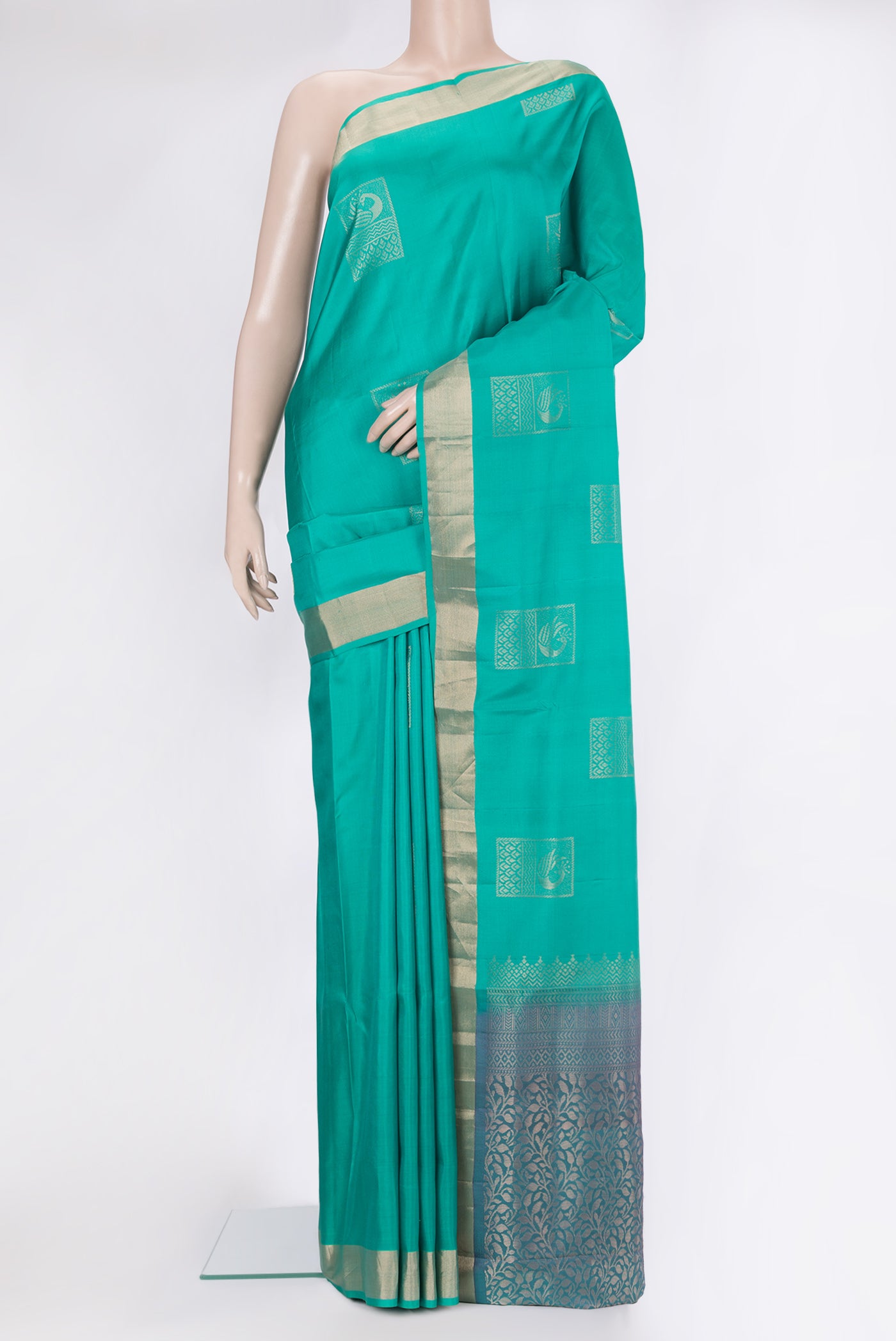 Sea Green Soft Silk Saree with Zari Butta on the body and Zari Border.  displayed on a mannequin