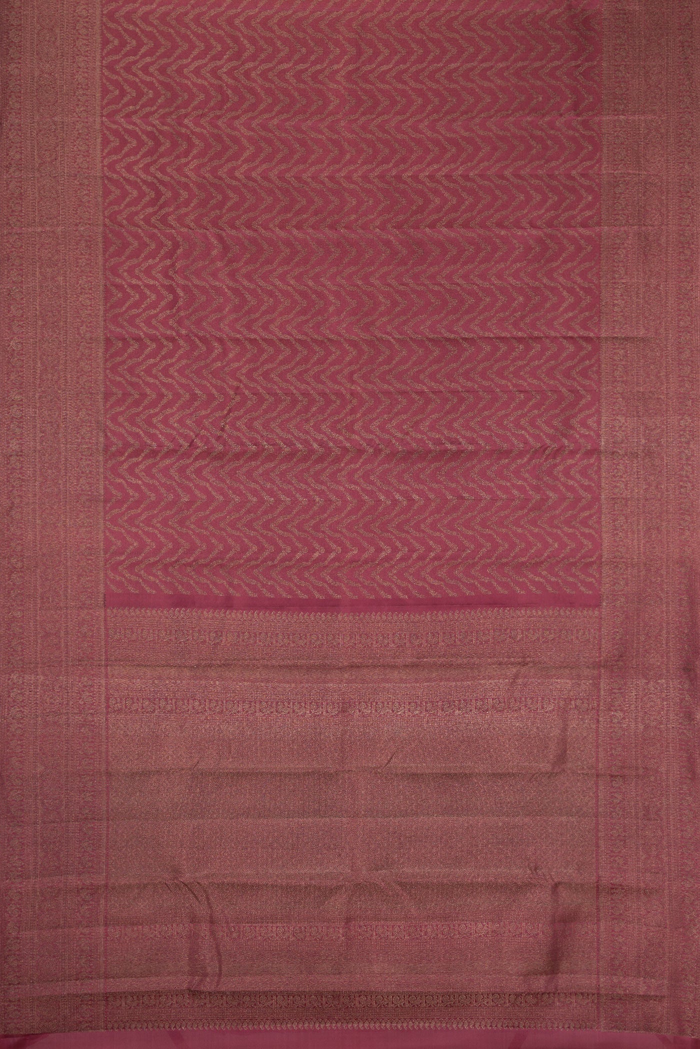 Flat view of Dark Mauve Dual Tone Kanjivaram Silk Saree with Jacquard design on the body and Zari Border. 
