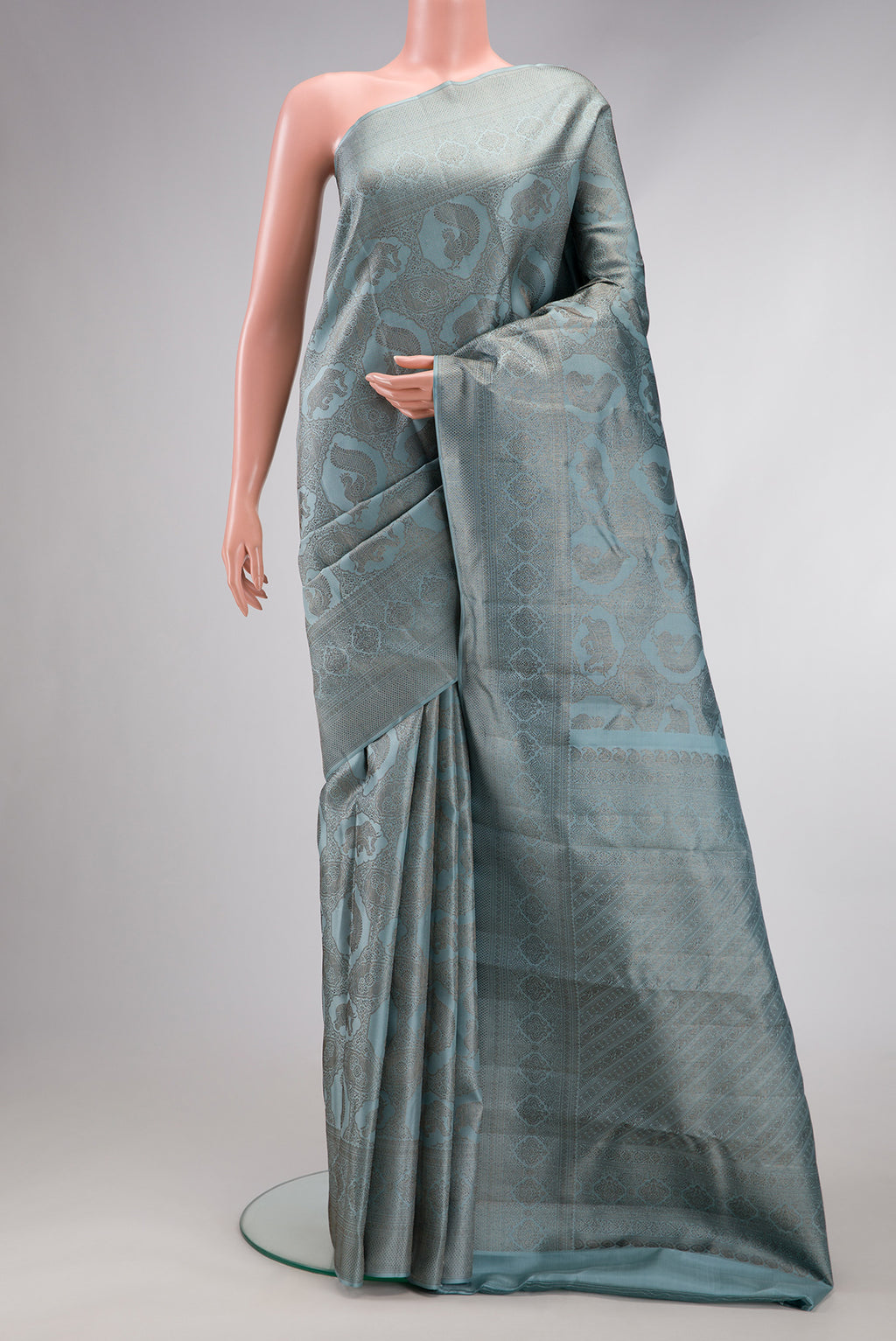Grey Dual Tone Kanjivaram Silk Saree with Jacquard design on the body and Fancy Border.  displayed on a mannequin