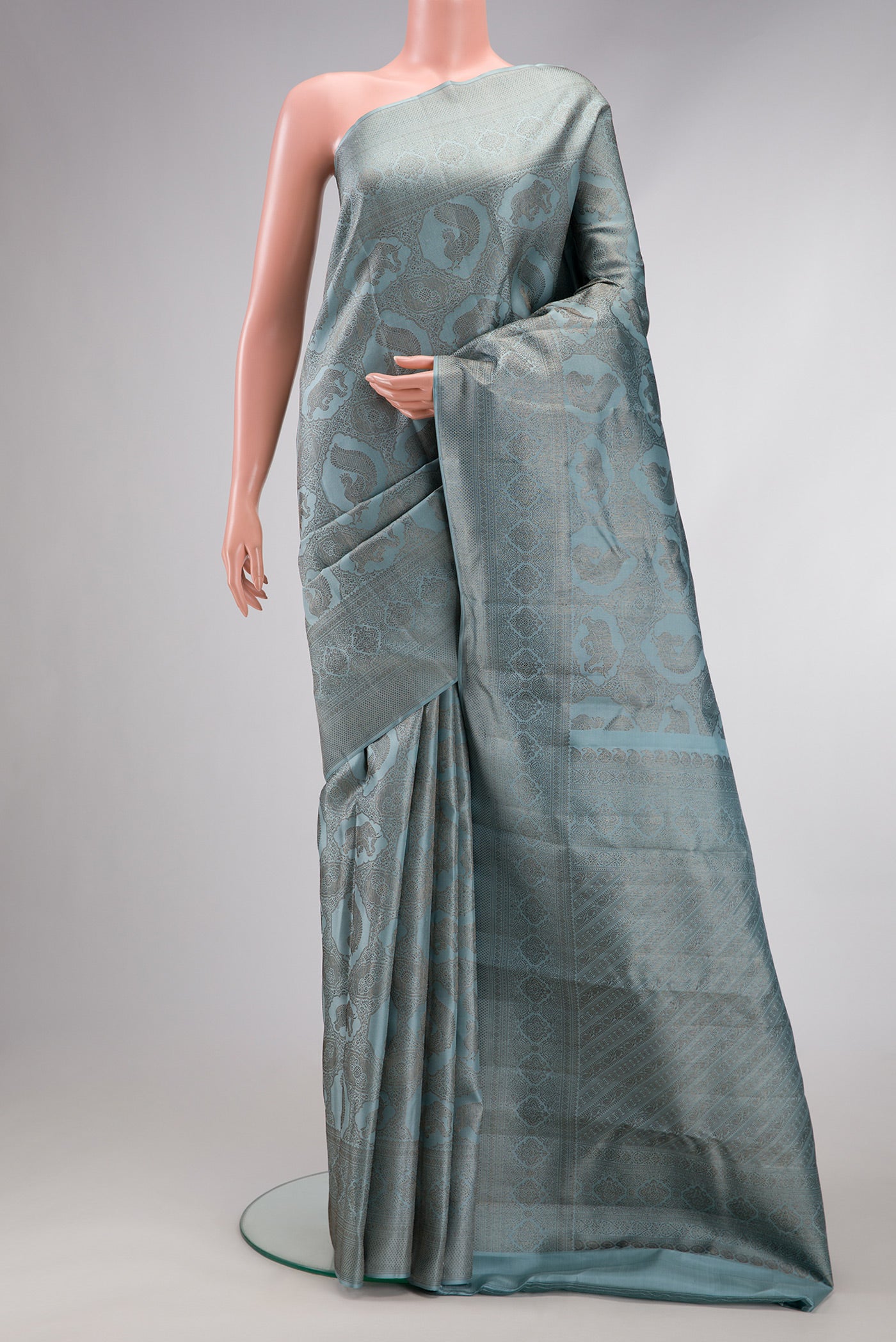 Grey Dual Tone Kanjivaram Silk Saree with Jacquard design on the body and Fancy Border.  displayed on a mannequin