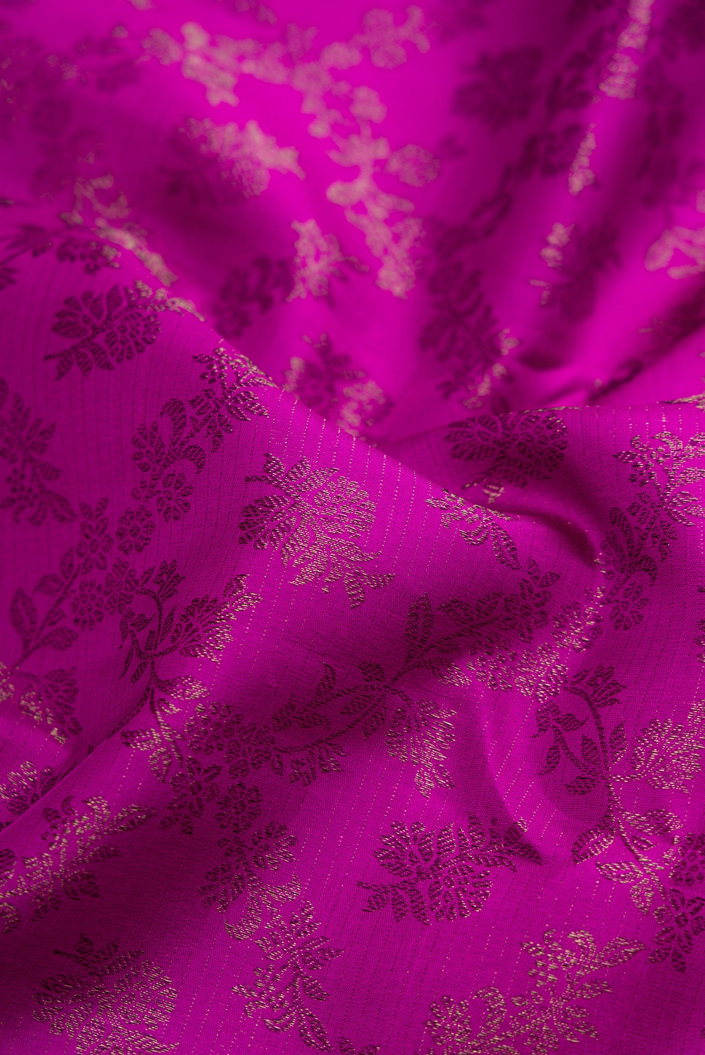 Close up of Purple Kanjivaram Silk Saree with Zari Brocade on the body and Fancy Border.  displaying folds