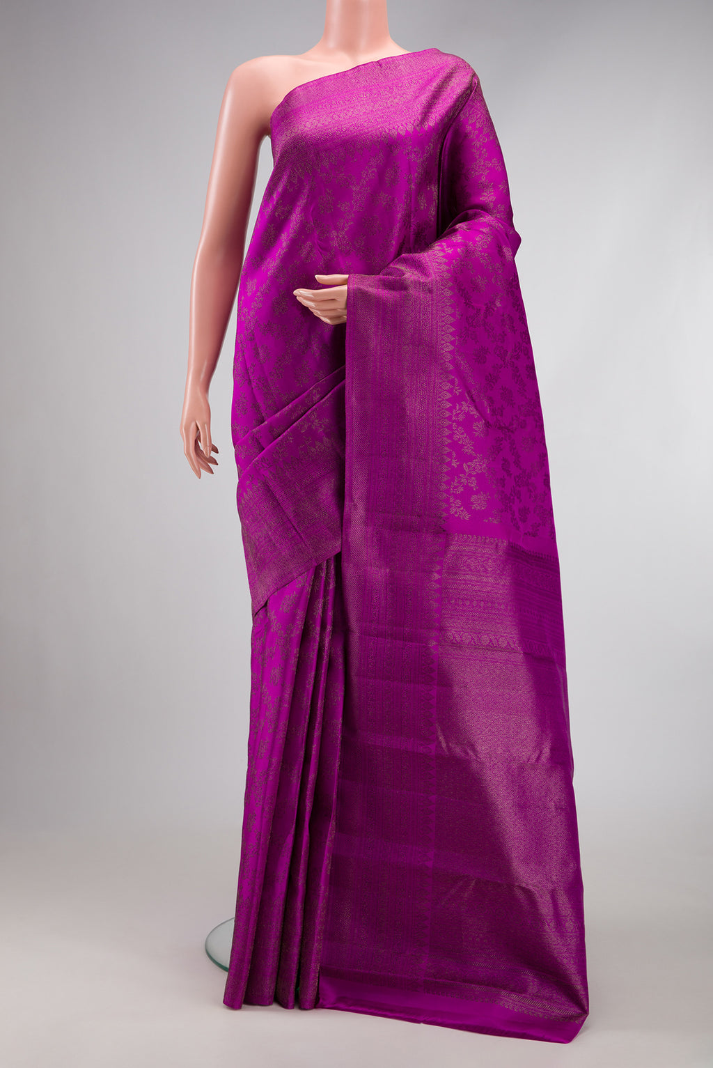 Purple Kanjivaram Silk Saree with Zari Brocade on the body and Fancy Border.  displayed on a mannequin