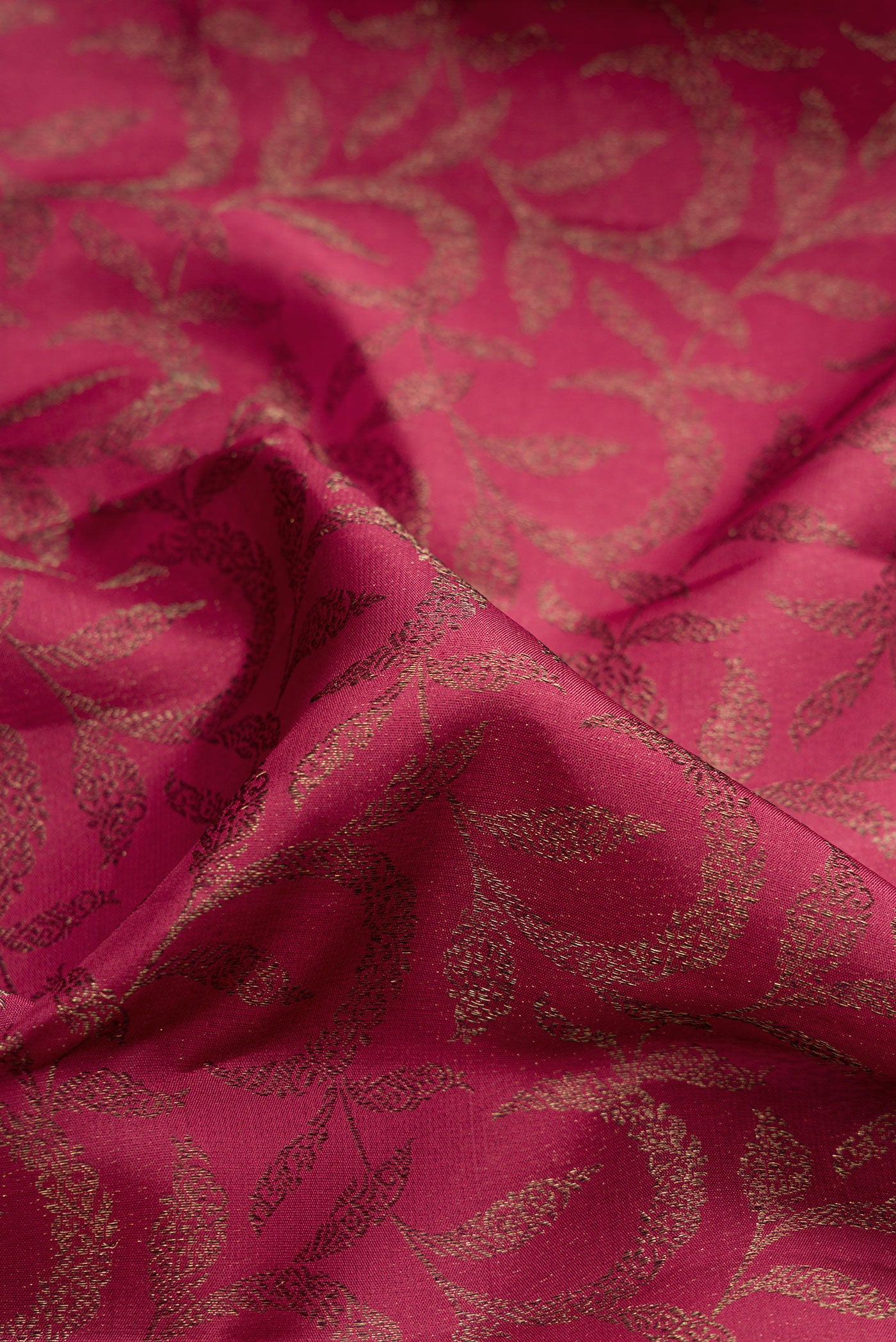 Close up of Maroon Kanjivaram Silk Saree with Zari Brocade on the body and Fancy Border.  displaying folds