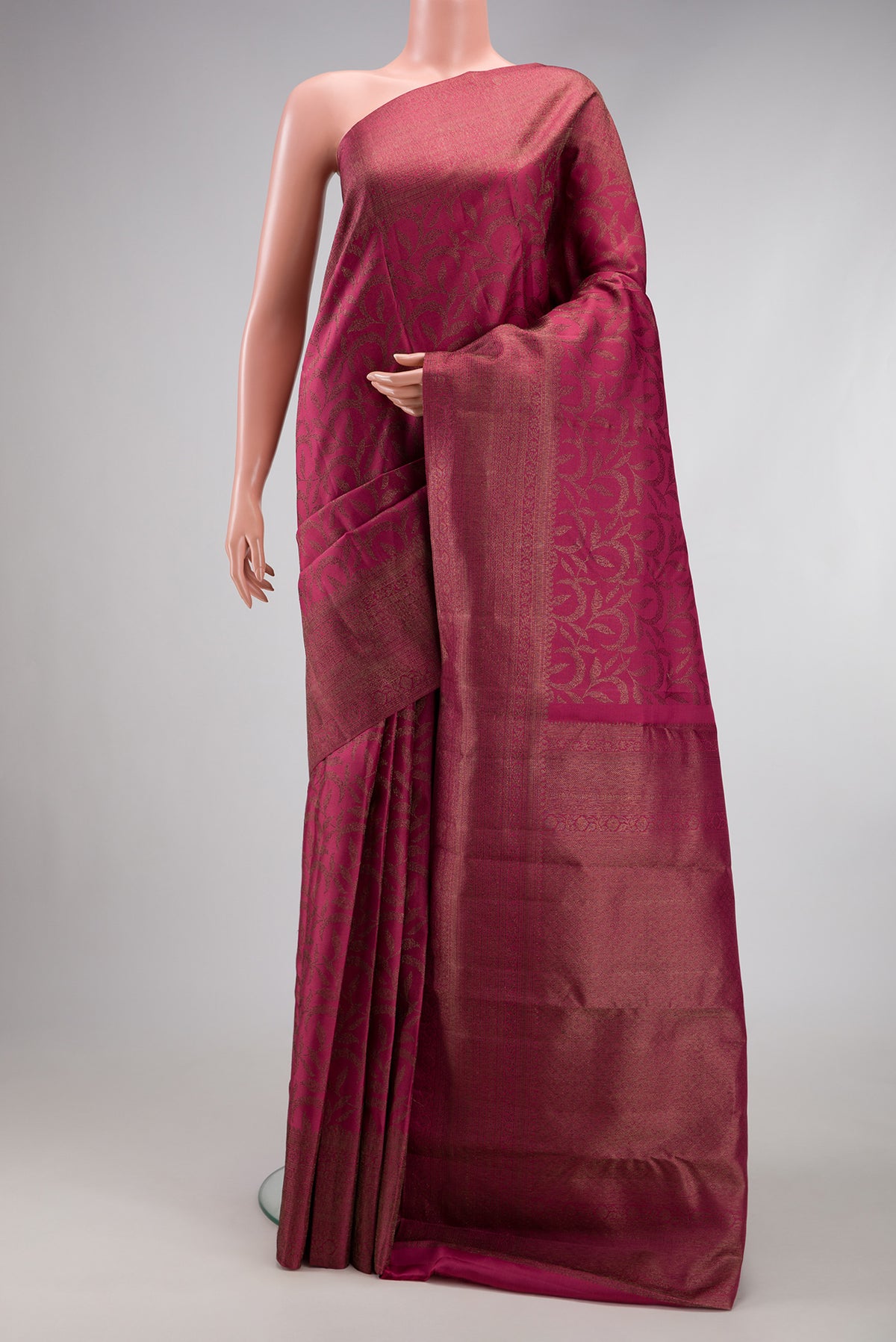 Maroon Kanjivaram Silk Saree with Zari Brocade on the body and Fancy Border.  displayed on a mannequin