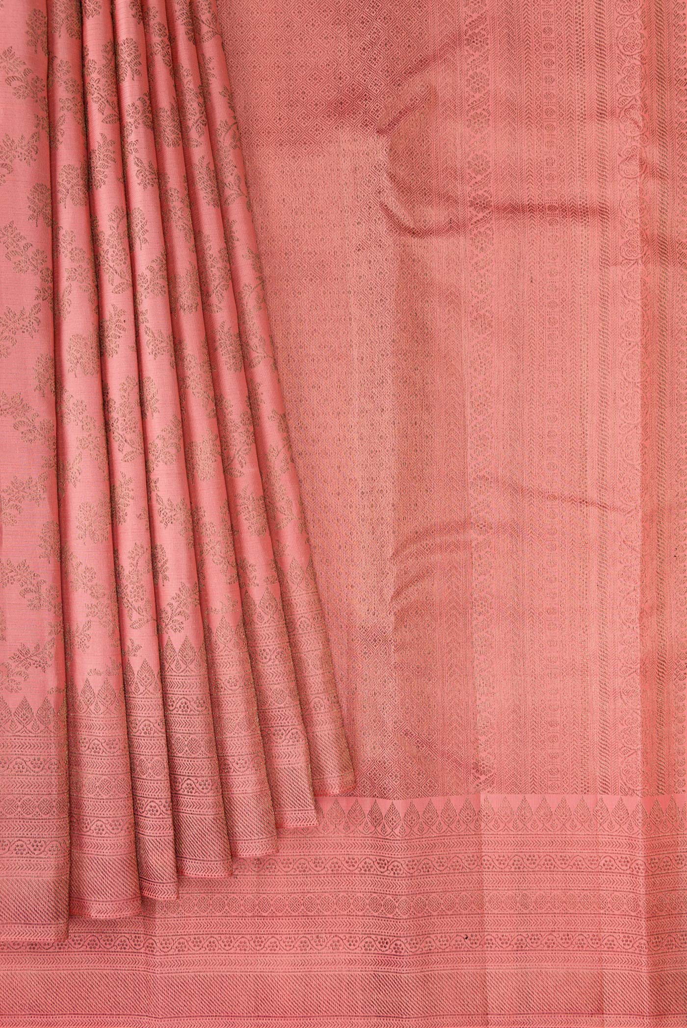 Pleats and pallu of Peach Kanjivaram Silk Saree with Zari Brocade on the body and Fancy Border. 