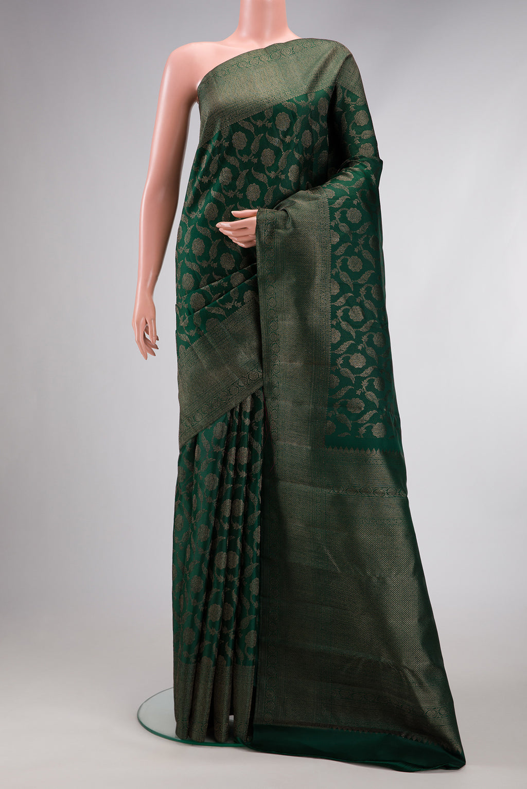 Bottle Green Dual Tone Kanjivaram Silk Saree with Jacquard design on the body and Fancy Border.  displayed on a mannequin