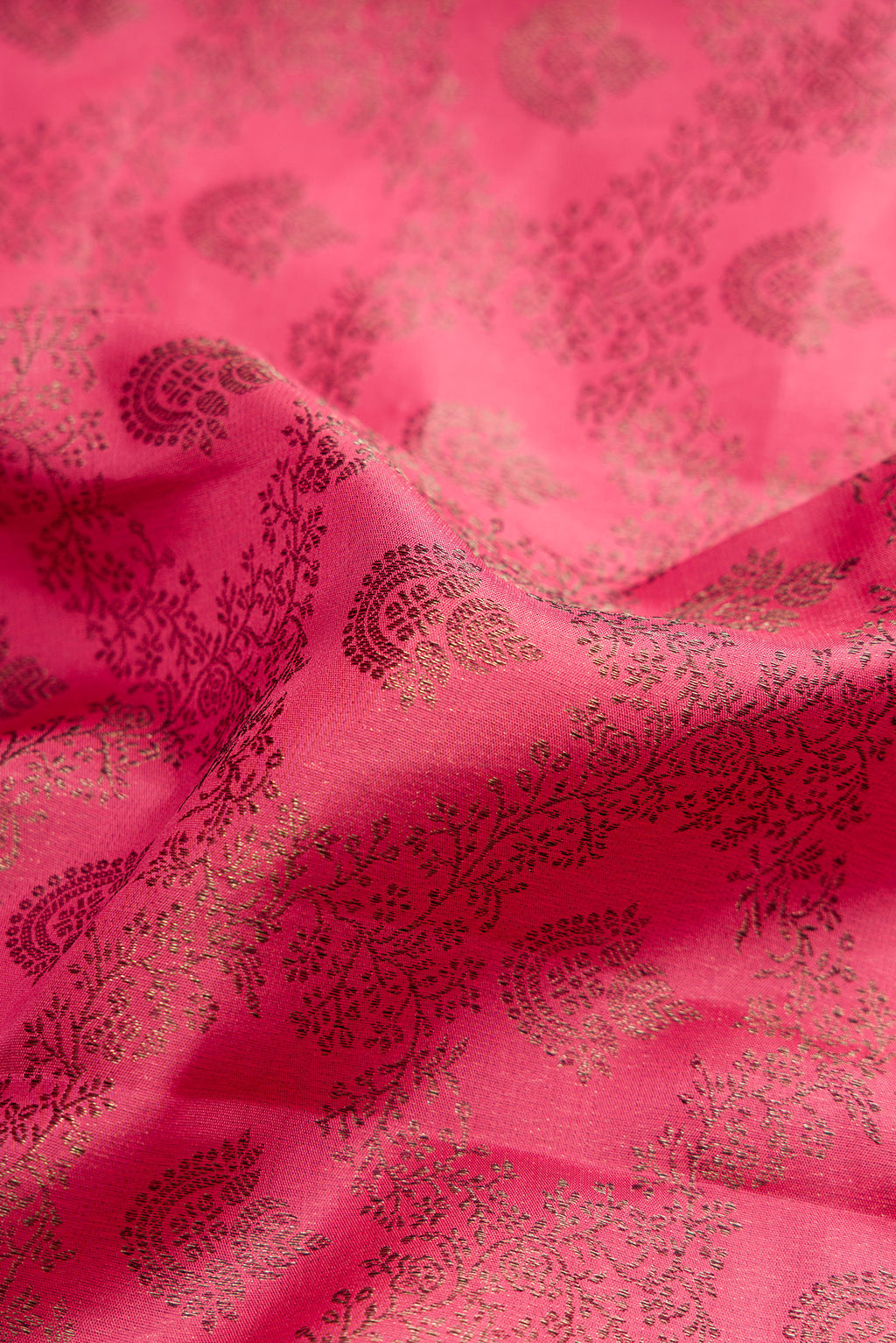 Close up of Pink Dual Tone Kanjivaram Silk Saree with Jacquard design on the body and Fancy Border.  displaying folds