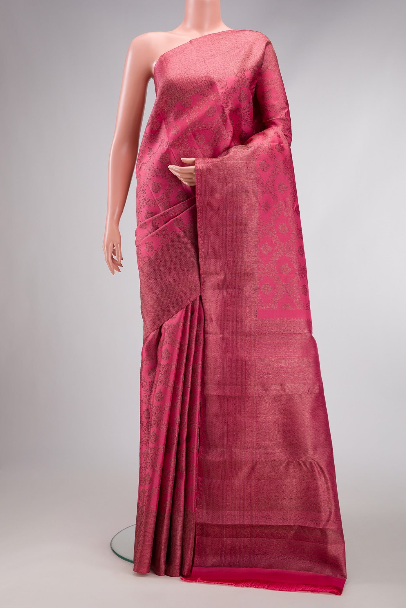 Pink Dual Tone Kanjivaram Silk Saree with Jacquard design on the body and Fancy Border.  displayed on a mannequin