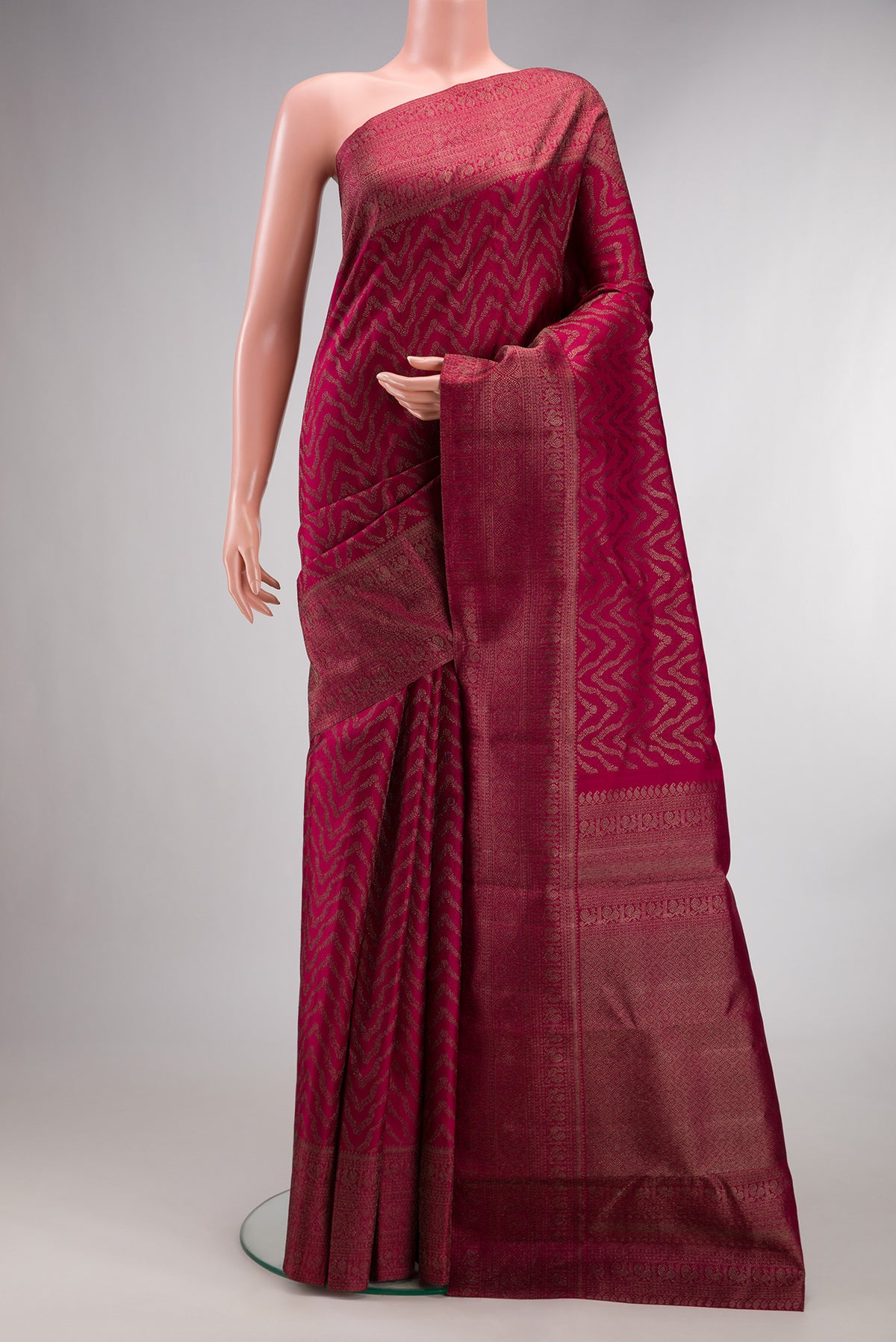 Pure Silk Maroon Kanjivaram Saree with Zari Brocade on the body and Fancy Border.  displayed on a mannequin