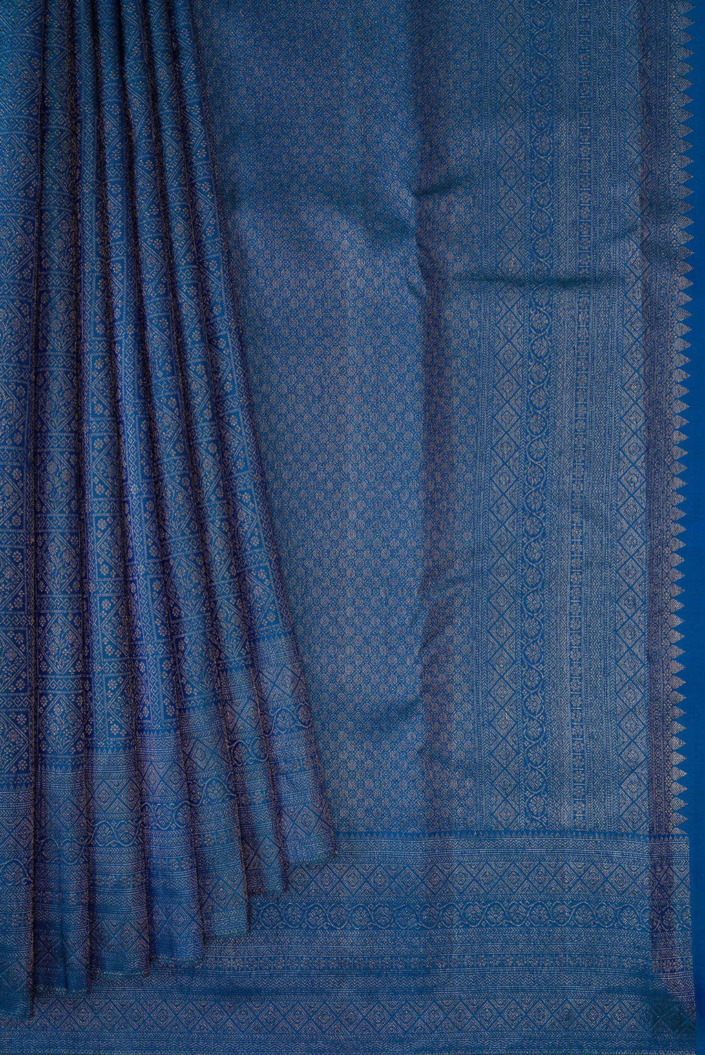 Pleats and pallu of Peacock Blue Dual Tone Kanjivaram Silk Saree with Zari Brocade on the body and Fancy Border. 