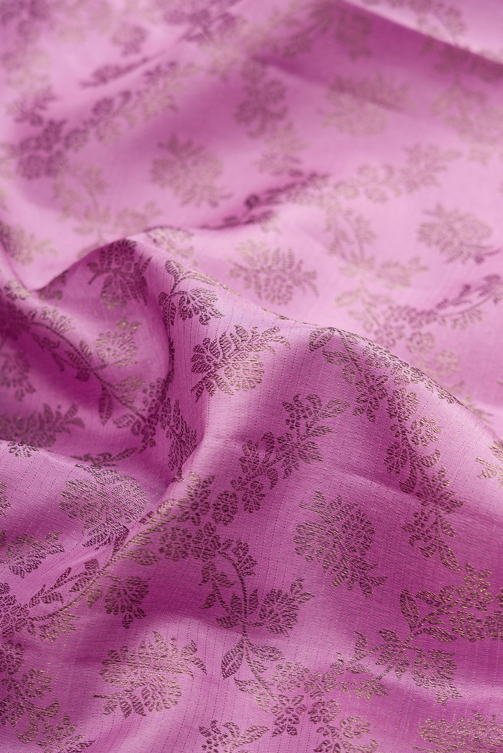 Close up of Lavender Kanjivaram Silk Saree with Zari Brocade on the body and Fancy Border.  displaying folds