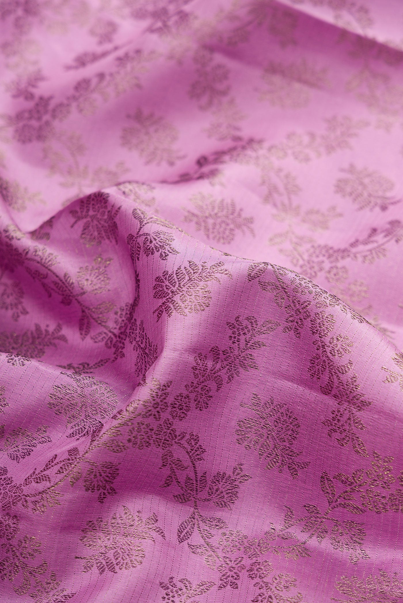 Close up of Lavender Kanjivaram Silk Saree with Zari Brocade on the body and Fancy Border.  displaying folds