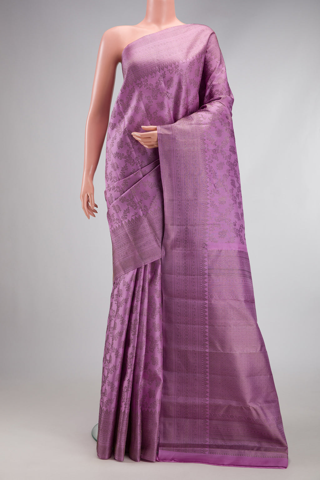 Lavender Kanjivaram Silk Saree with Zari Brocade on the body and Fancy Border.  displayed on a mannequin