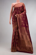 Maroon Kanjivaram Silk Saree with Zari Brocade on the body and Fancy Border.  displayed on a mannequin
