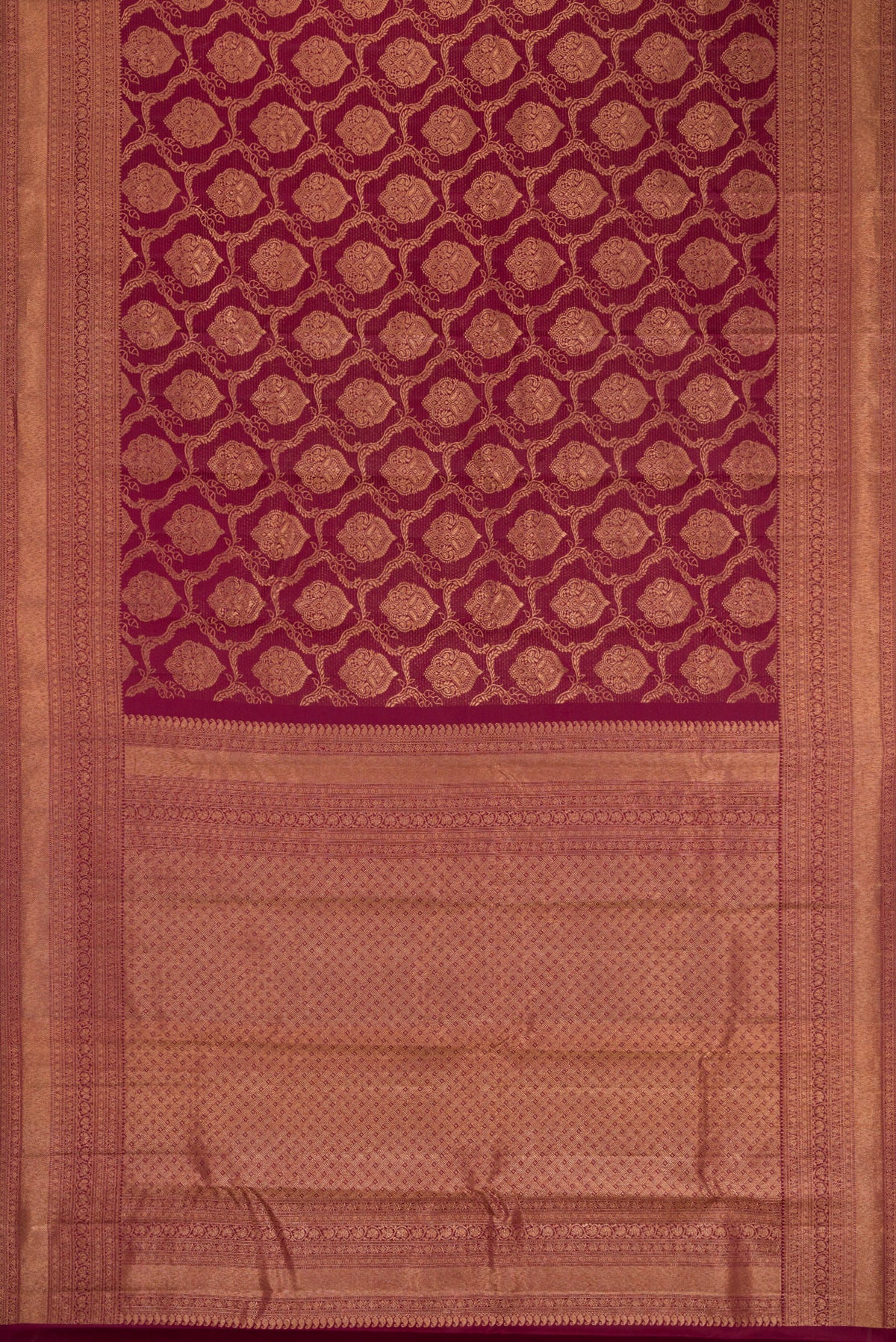Flat view of Maroon Kanjivaram Silk Saree with Zari Brocade on the body and Fancy Border. 