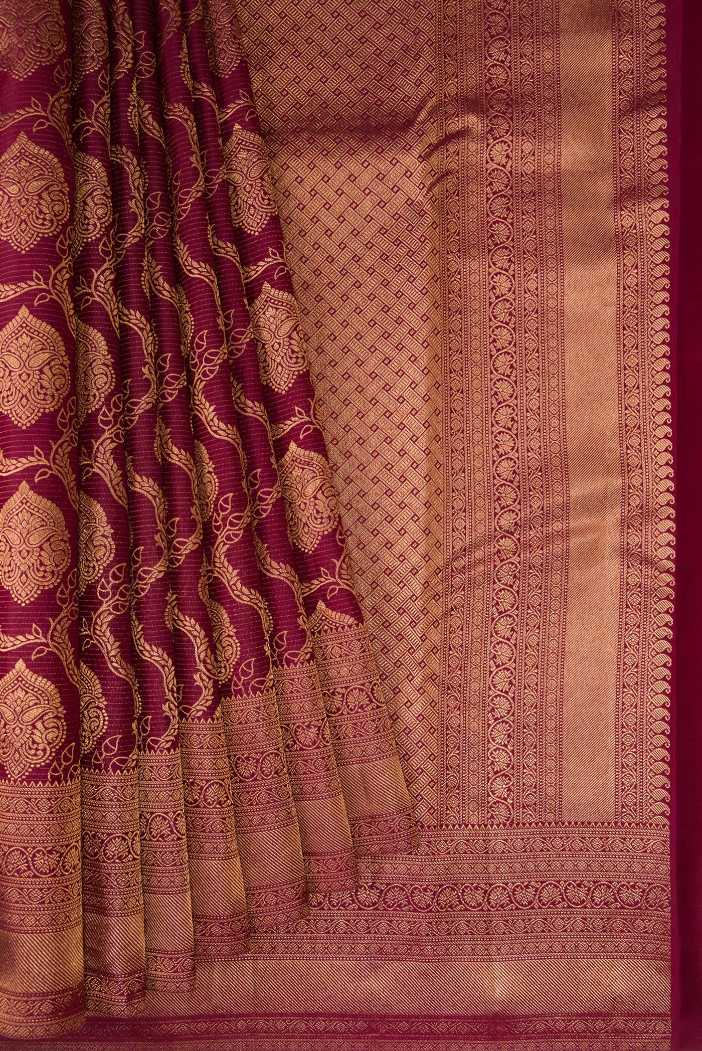 Pleats and pallu of Maroon Kanjivaram Silk Saree with Zari Brocade on the body and Fancy Border. 