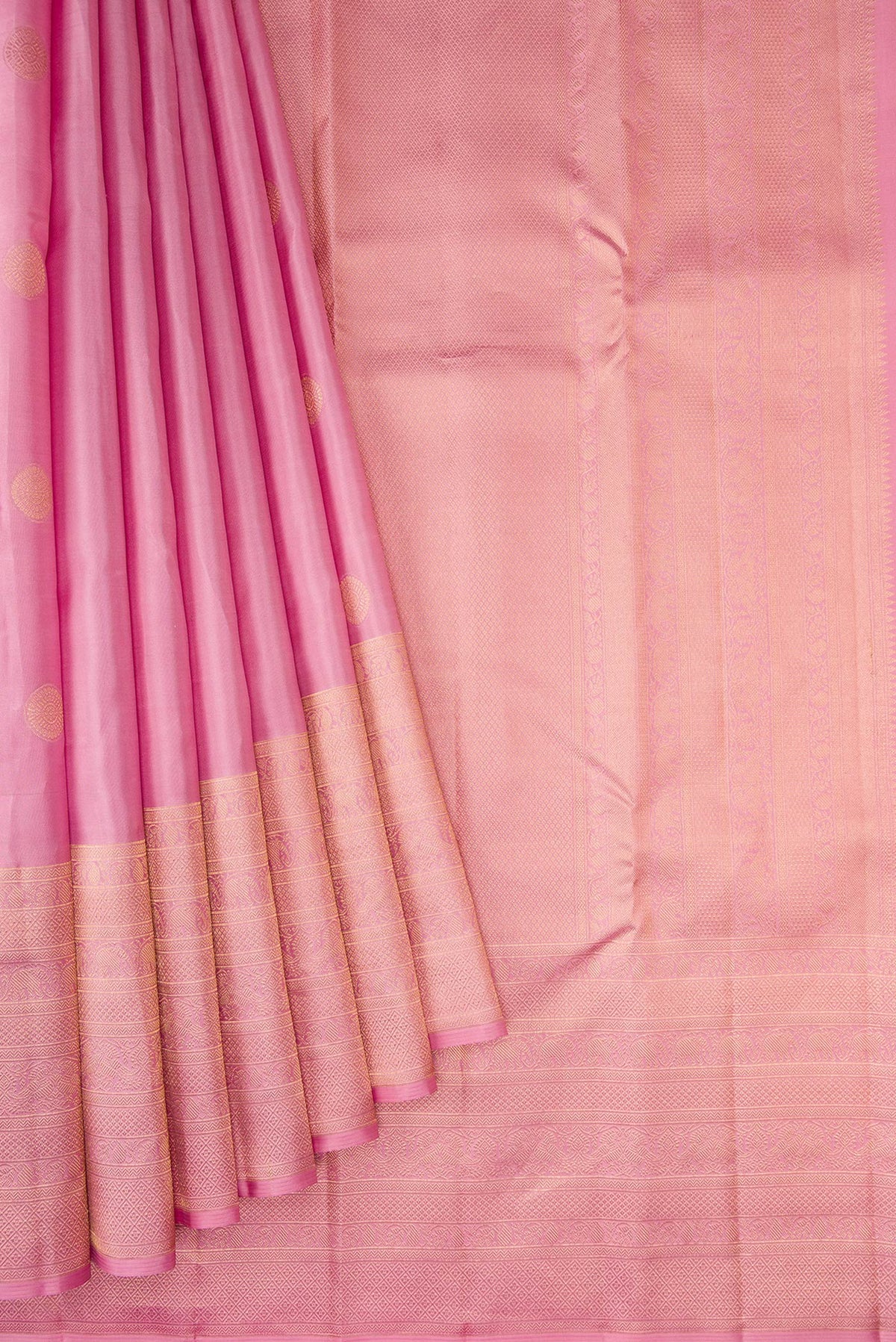 Pleats and pallu of Rose pink Kanjivaram Silk Saree with Zari Butta on the body and Fancy Border. 