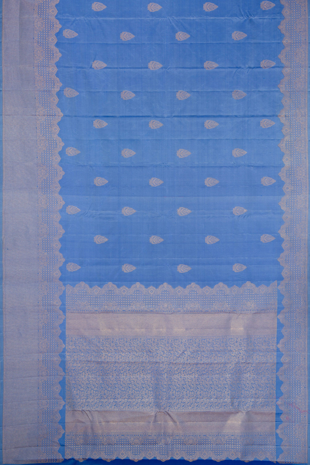 Flat view of Blue Kanjivaram Silk Saree with Zari Butta on the body and Fancy Border. 