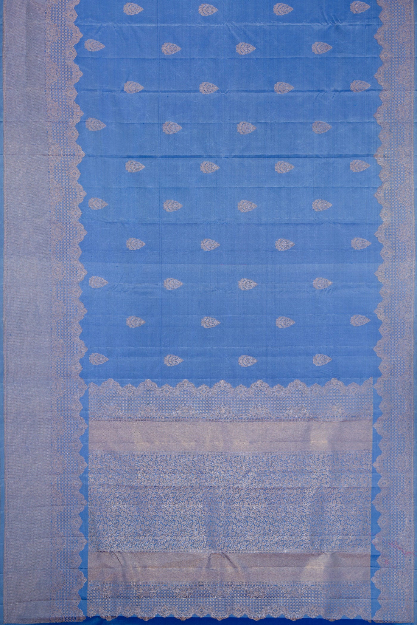 Flat view of Blue Kanjivaram Silk Saree with Zari Butta on the body and Fancy Border. 