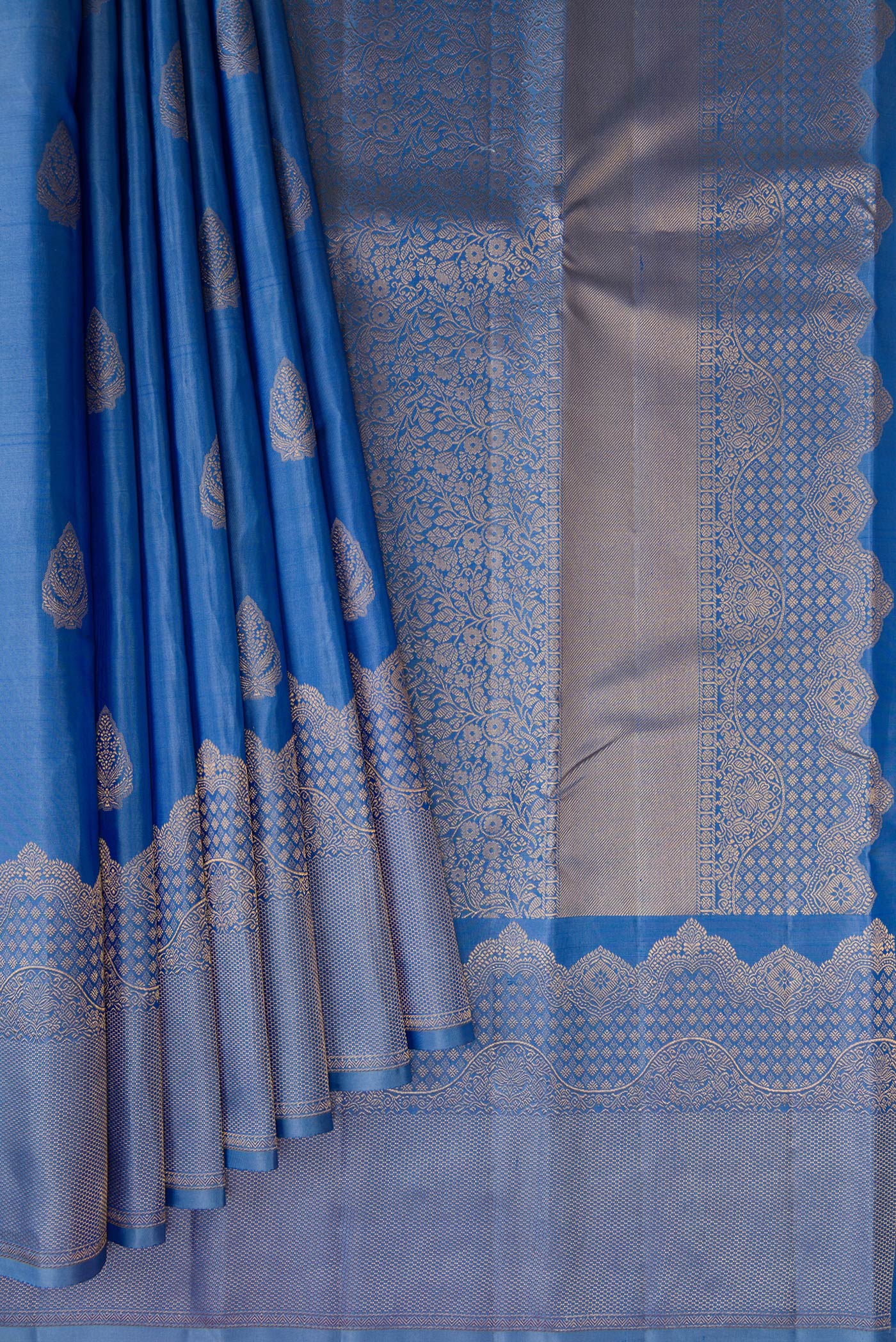 Pleats and pallu of Blue Kanjivaram Silk Saree with Zari Butta on the body and Fancy Border. 