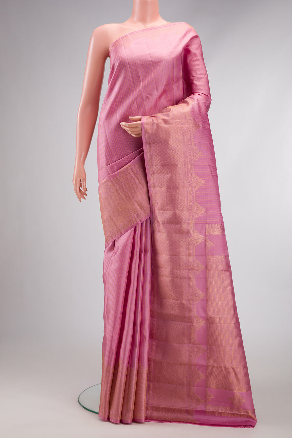 Pink Dual Tone Kanjivaram Silk Saree with Stripes on the body and Fancy Border.  displayed on a mannequin