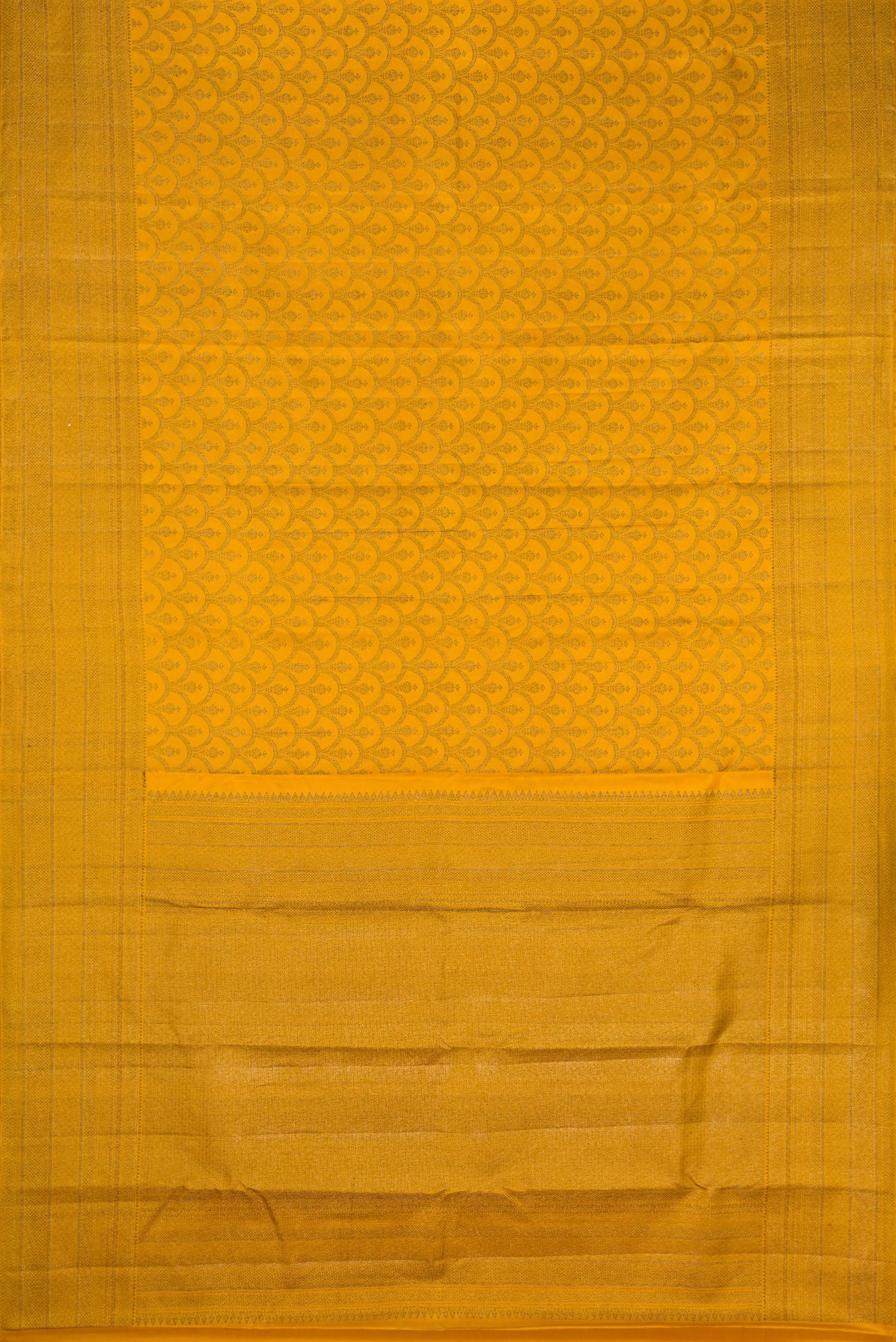 Flat view of Mustard Kanjivaram Silk Saree with Jacquard design on the body and Fancy Border. 