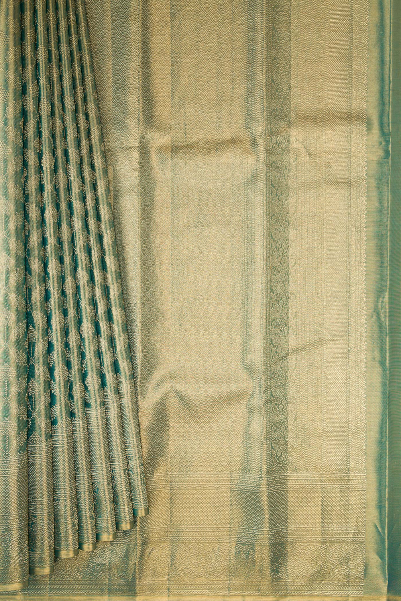 Pleats and pallu of Green Dual Tone Kanjivaram Tissue Silk Saree with Zari Brocade on the body and Zari Border. 