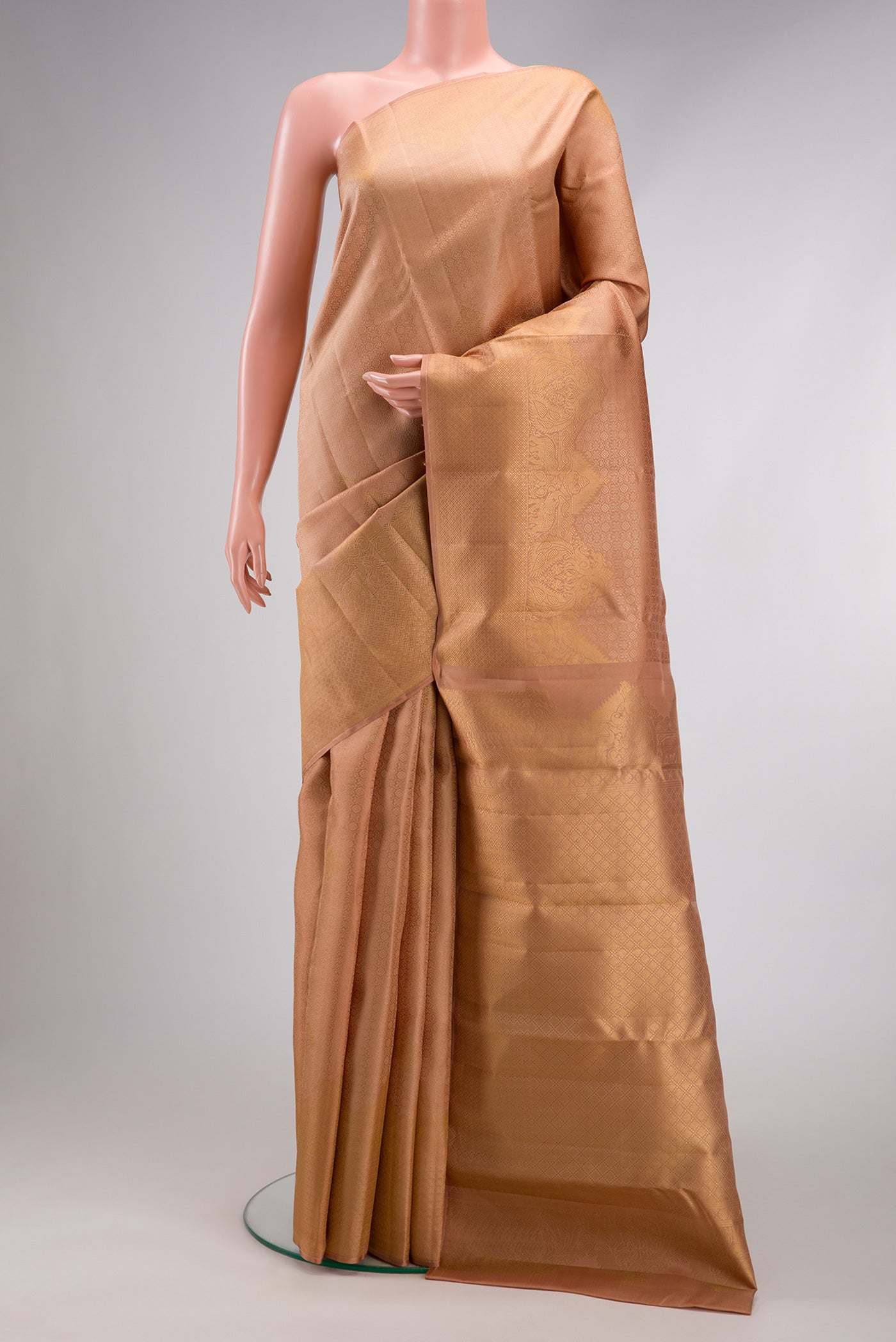 Golden Peach Dual Tone Kanjivaram Silk Saree with Jacquard With Zari Butta on the body and Fancy Border.  displayed on a mannequin